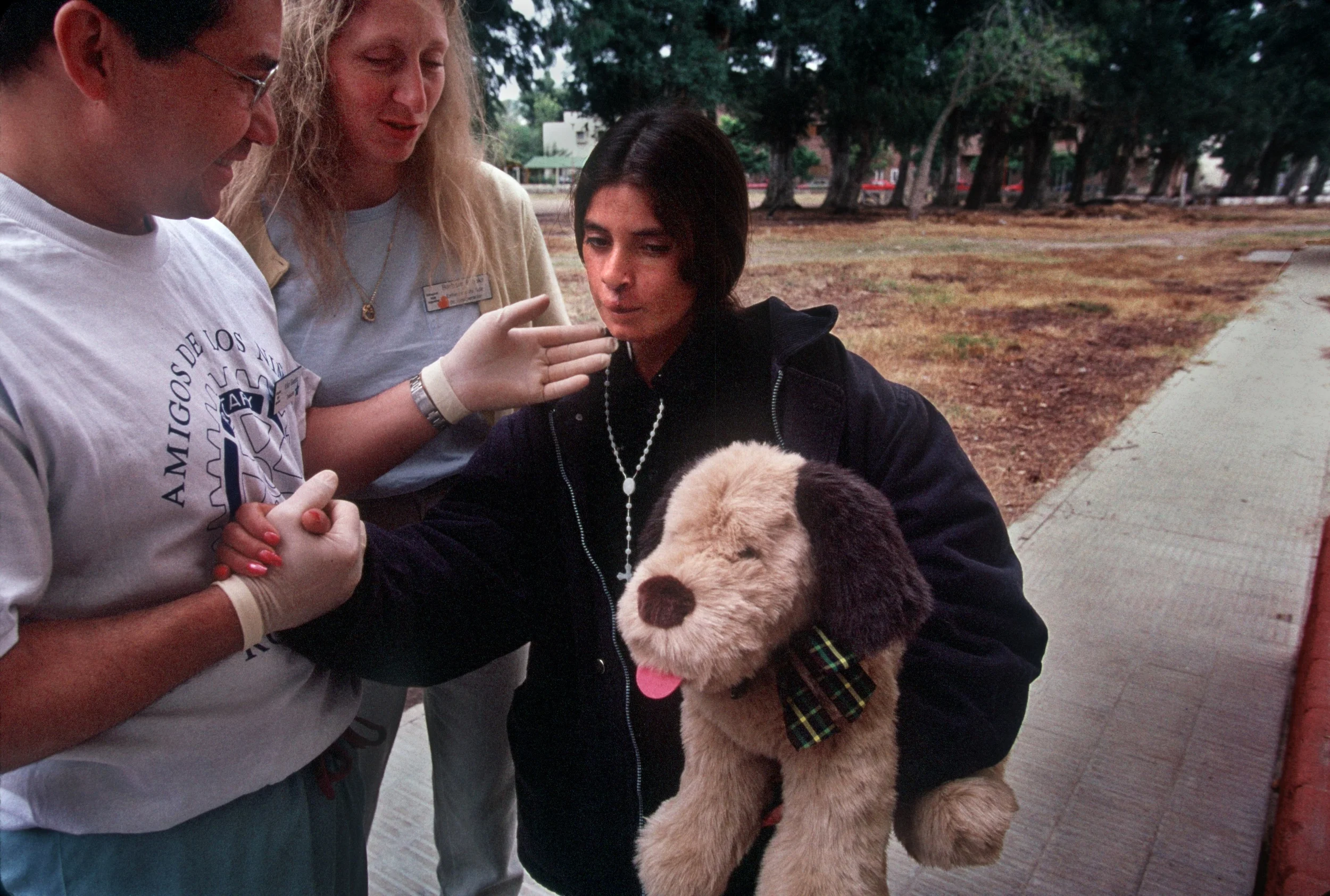 Left, Rotoplast team members Kiko Guedez and Barbara Brooks say their goodbyes to Mercedes Paz, who had her face transformed by the international team of doctors. For 18 years her disfigured cleft lip made her a recluse. ©Gail Fisher for Los Angeles Times 