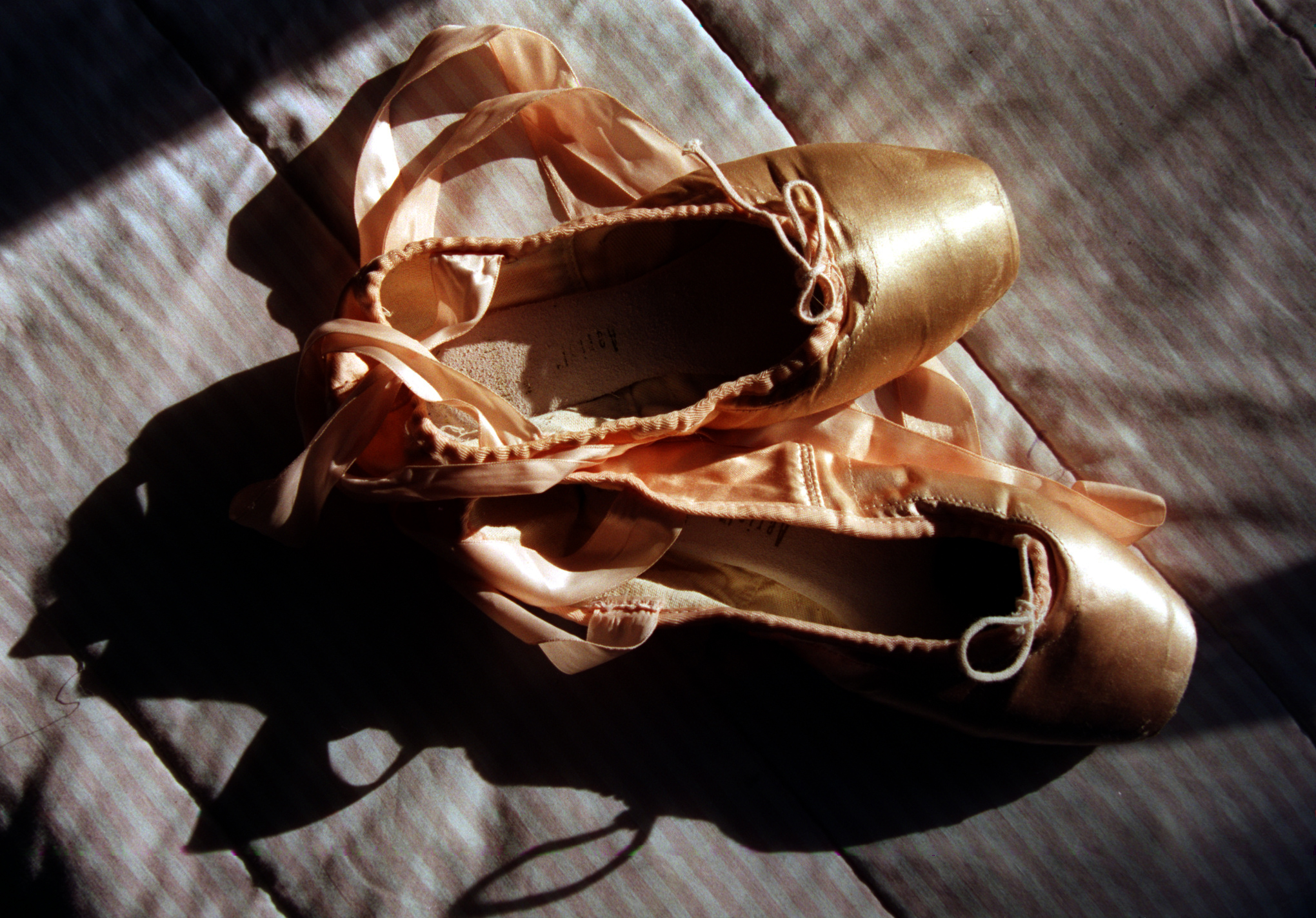Thelma’s point shoes that she used to dance with at St. Joseph's Ballet until she quit three months ago. ©Gail Fisher Los Angeles Times 