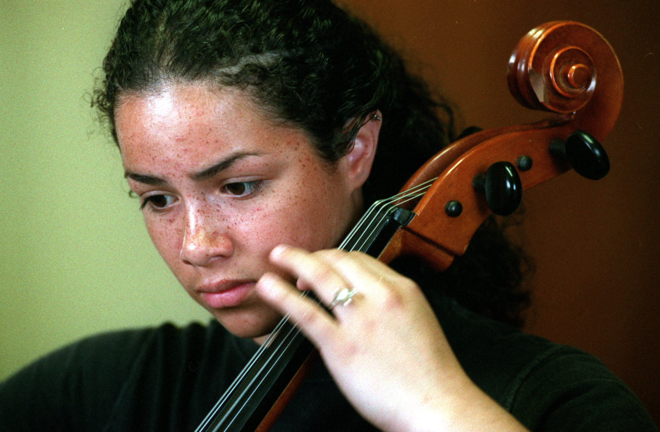 Last year during eighth grade, Thelma decided to learn to play the cello. In exchange for cleaning her teacher's house, Ardelle Womack gives her cello lessons. She is now in the school district's honors orchestra. ©Gail Fisher Los Angeles Times