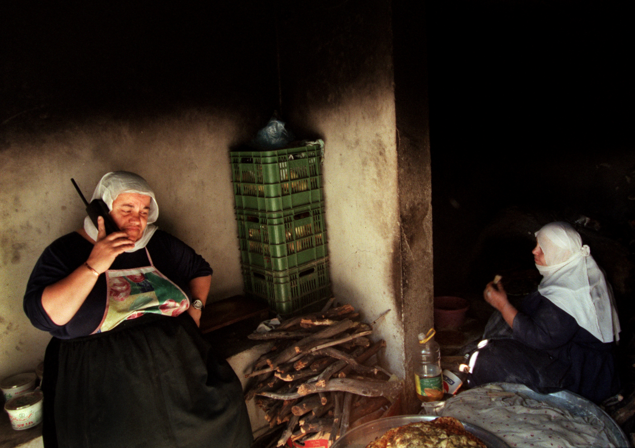 The Orange County Interfaith group visited a Druze village in Isfiya, Israel, learning about their unique religion and culture while Druze women prepared pita bread for the group's lunch in traditional fire ovens. ©Gail Fisher Los Angeles Times