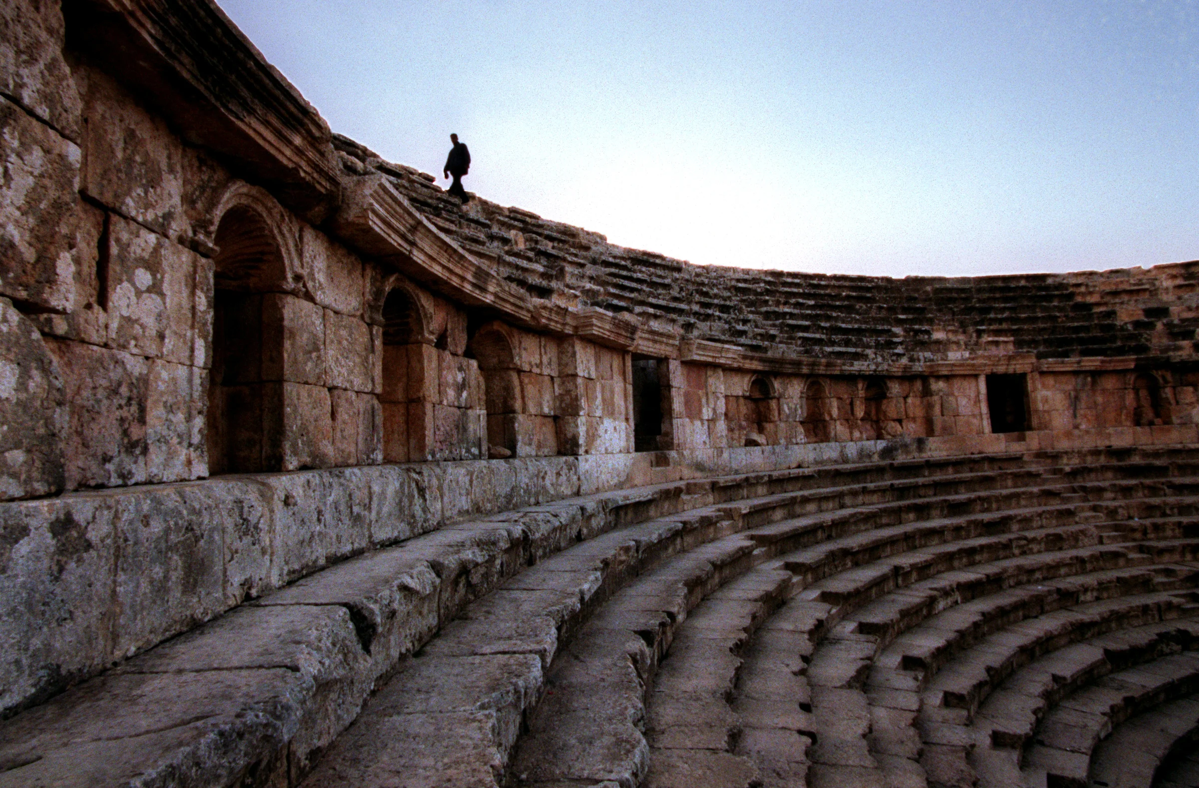 Haithan Bundakji walks in the ruins at Jerash, in the Kingdom of Jordan, one of the best preserved examples of Roman civilization known as the "Pompeii of the East" built inAD 129 to honor the Roman Emperor Hadrian. As a child, Bundakji lived across the street from the ruins and this was his play ground up until the age of 8 years old. ©Gail Fisher Los Angeles Times