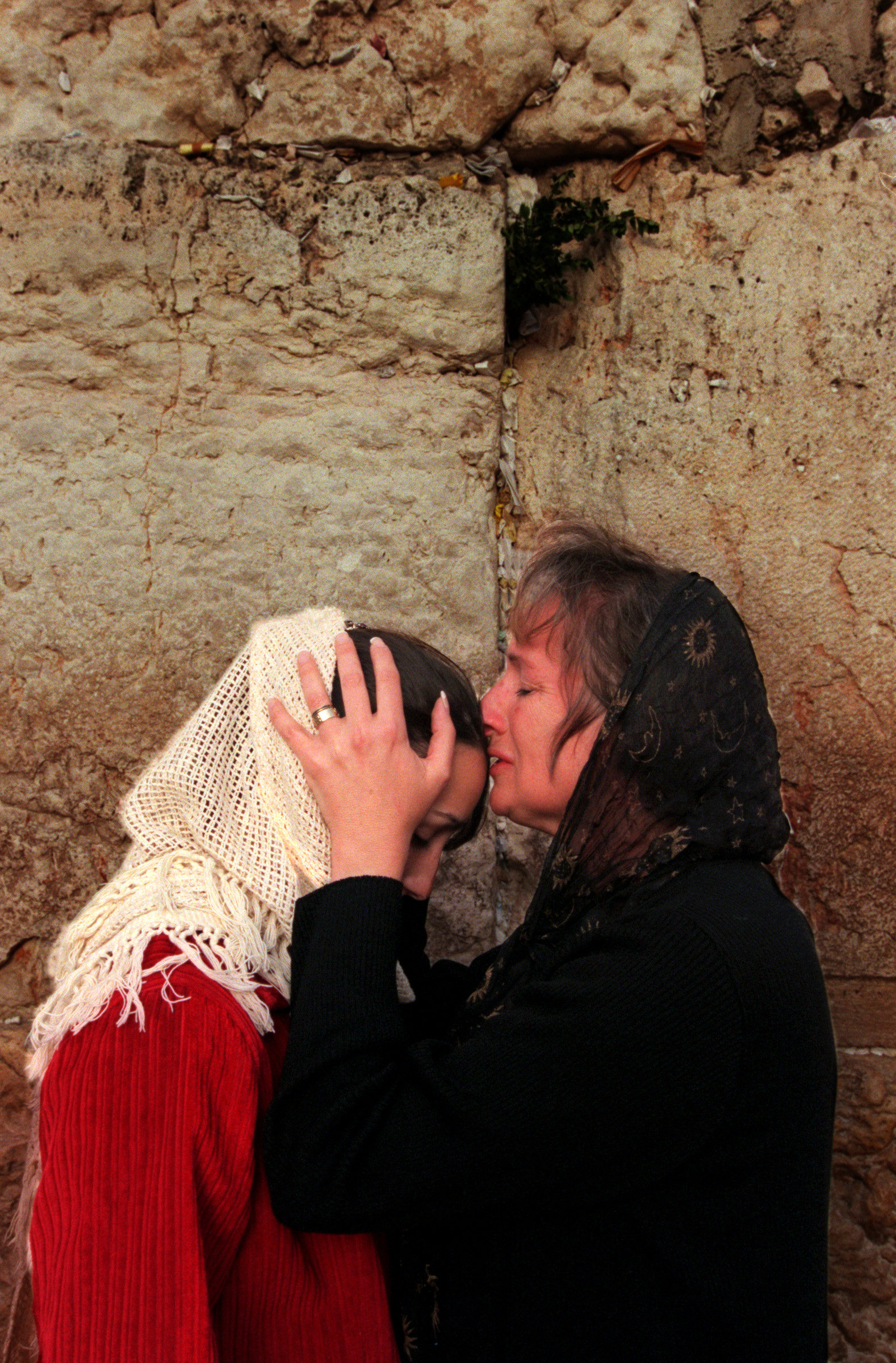  Left, Adeena King and her mother Barbara,&nbsp; over come with emotion, pray at the Western Wailing Wall, in Old City Jerusalem, one of the most Holy sites in Judaism.&nbsp;©Gail Fisher Los Angeles Times 