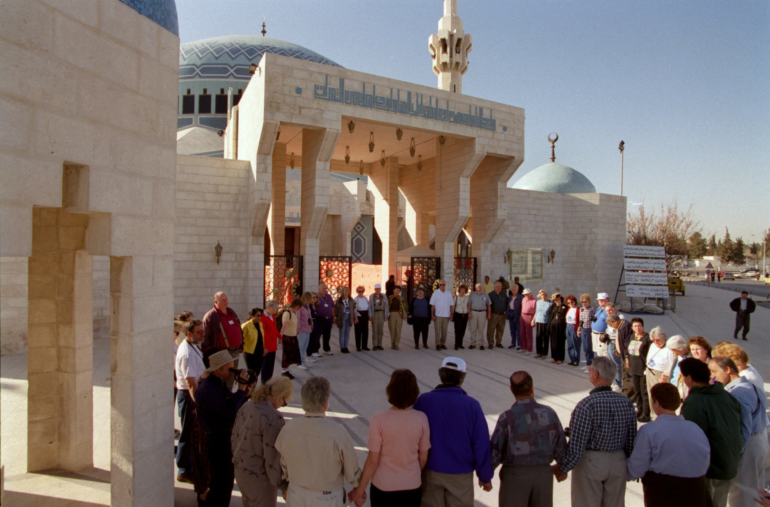 Orange County interfaith group prays in front of King Abdullah's Mosque in Amman, Jordan. Interfaith group traveled to various Christian, Jewish and Muslim sites during their pilgrimage. ©Gail Fisher Los Angeles Times