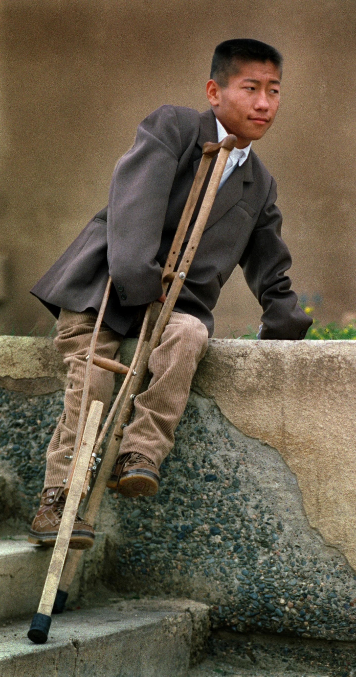 Anchig Oidov, 17, a young scholar in Russian languages, traveled from the Gobi desert to see help from American doctors forcongenital arthrogriposis - which means his joints seize up so that he can't straighten his hands or walk without crutches. There's a chance surgery in the U.S. can make him more functional, and able to use a computer. ©Gail Fisher Los Angeles Times