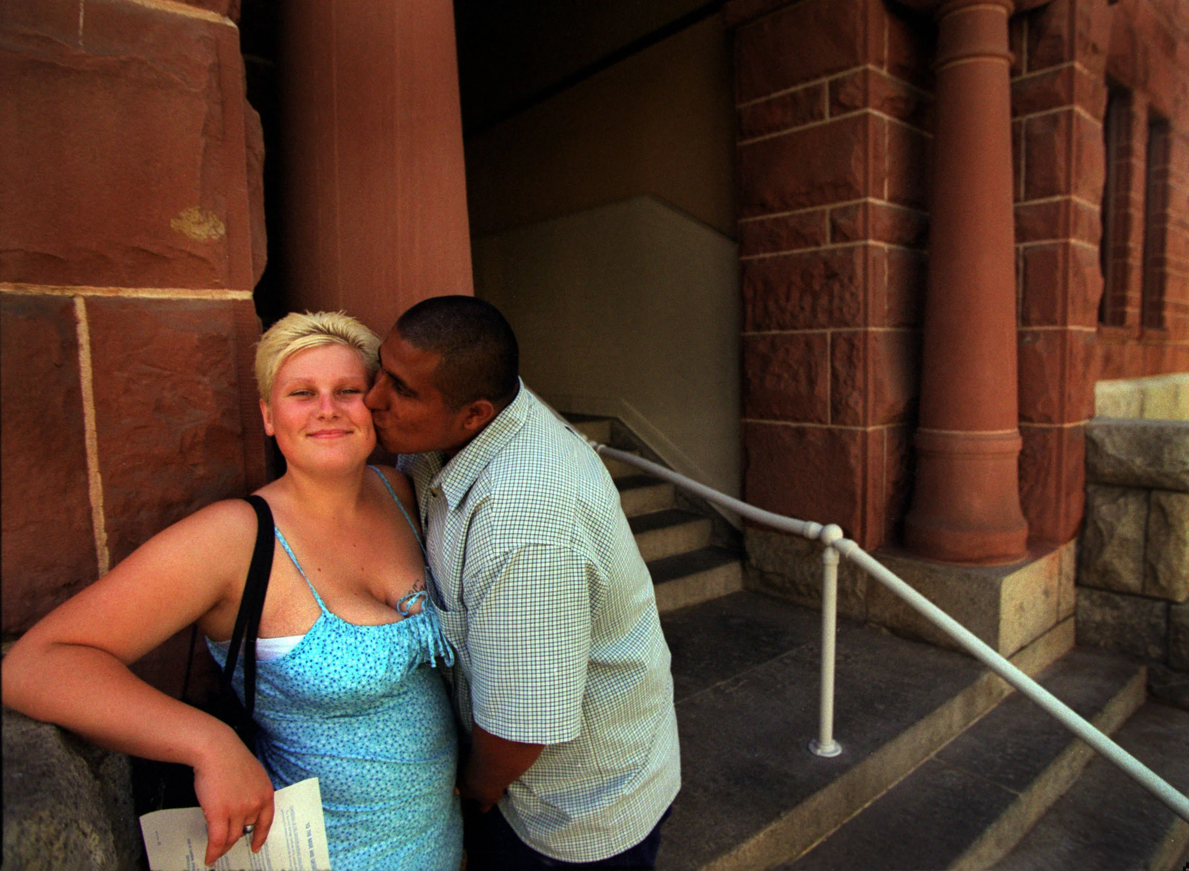 Only a few weeks after Janea has aged out of the foster care system she marries Sam Lopez, also a foster care child. They skipped the big wedding for the altar in the Orange County Marriage License Office in Santa Ana. ©Gail Fisher Los Angeles Times 