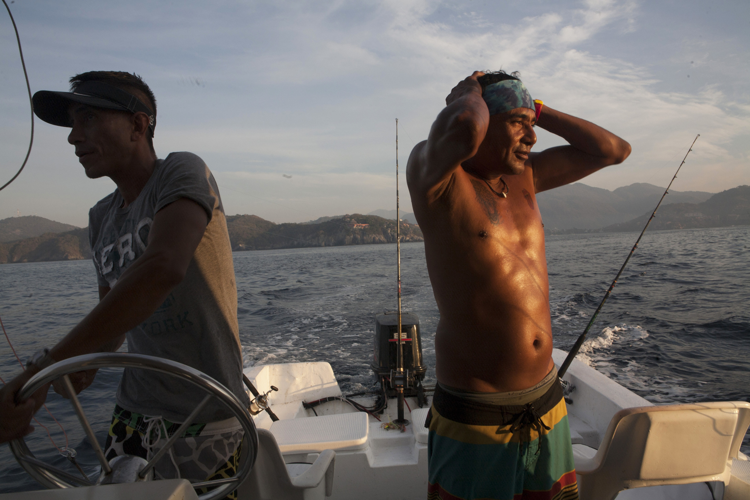  Polo Flores, right and Gustavo Farfan, left, were our fishing and snorkeling guides aboard the "Reny," where we spent the day enjoying the the Zihuatanejo Bay from a different perspective. ©Gail Fisher&nbsp; 