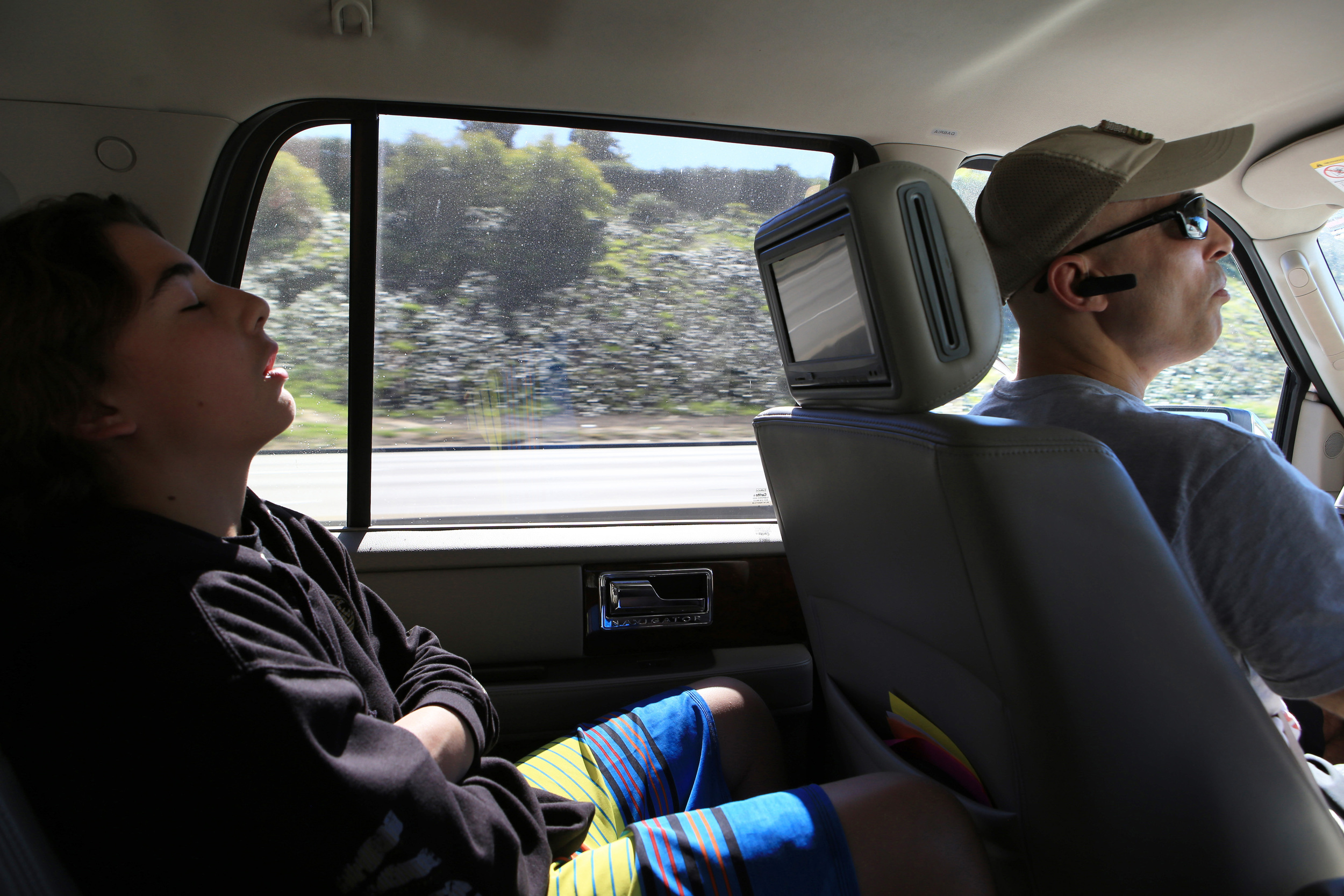  Gracie's son Kheydon, 13, left, ditches school and naps in the back seat as his father navigates his way through heavy Los Angeles traffic on his way to The Yard to train for an upcoming fight.&nbsp; (©Gail Fisher for ESPN) 