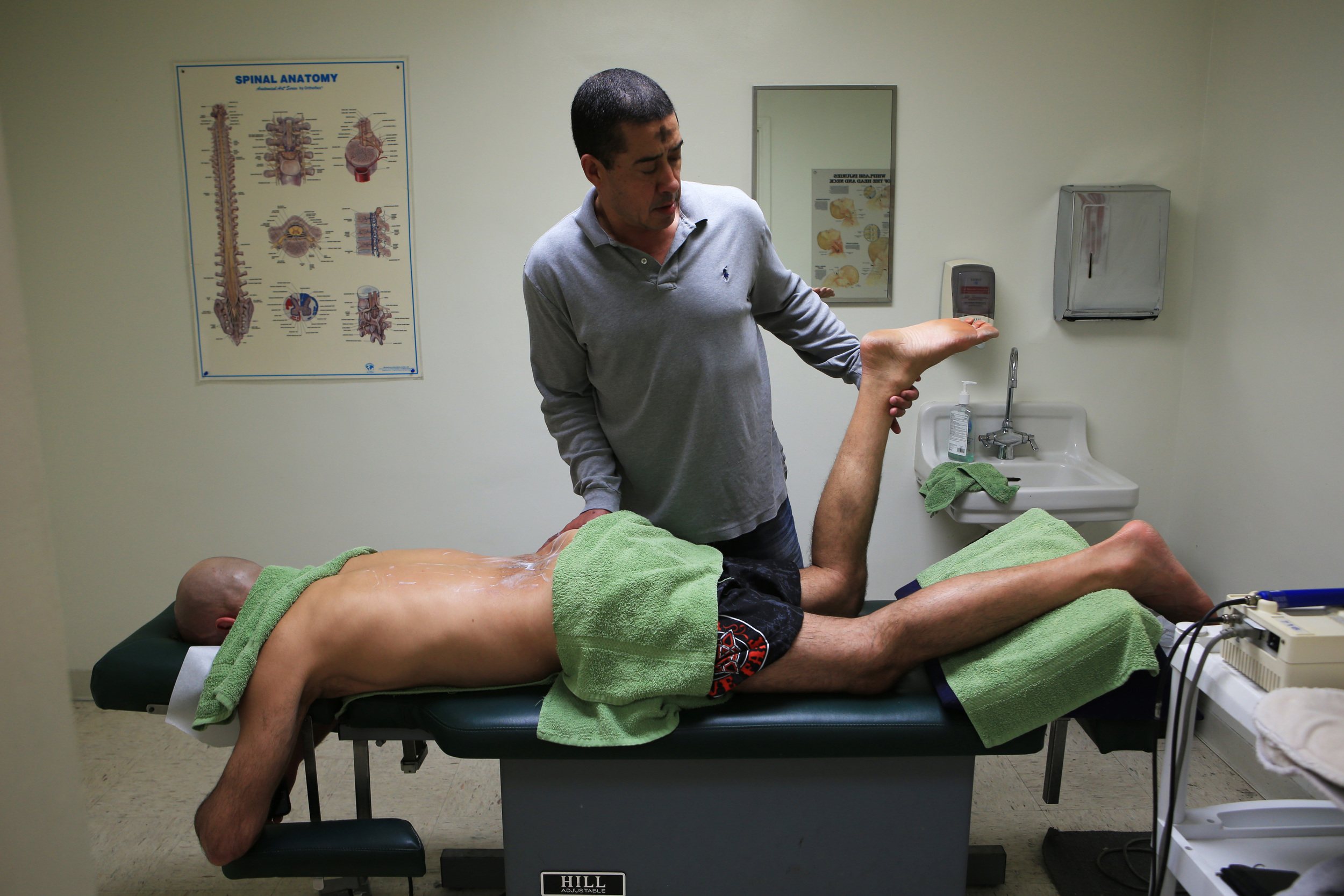  Fowler-Reida, a doctor who specializes in the treatment of the spine, skeletal, muscle and nervous system, works on Gracie, 49, who has been his patient and friend for the past twenty years, and needed work on his body after a hard day of training. 