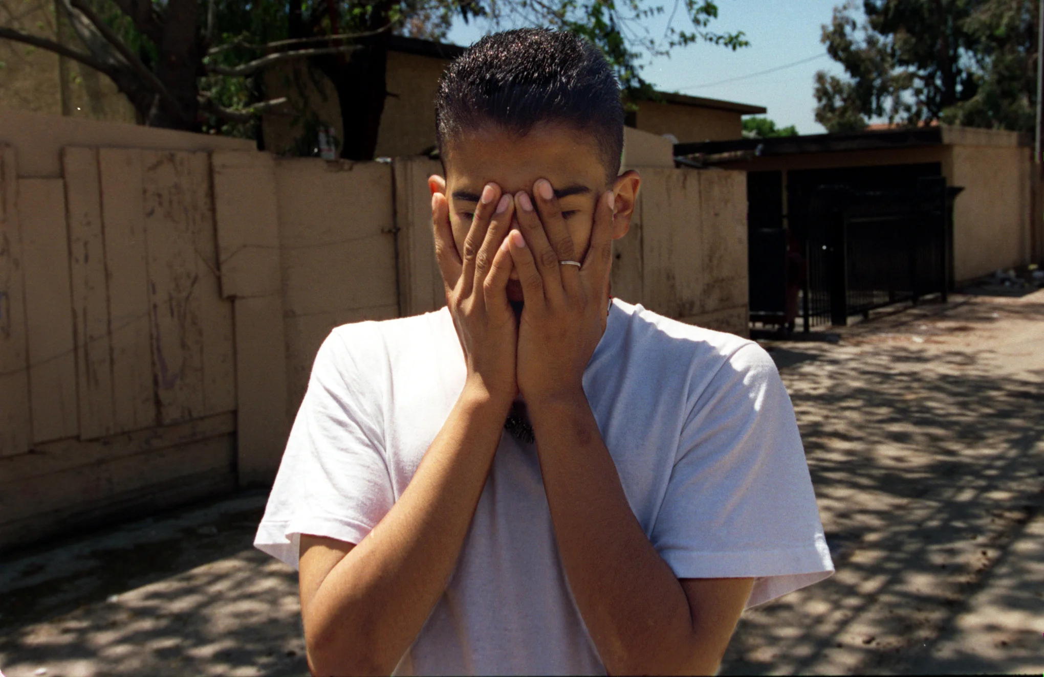 Marco, 16, is confused andworries about the future, whether to stay in school or drop out and find a job. He fears sometimes that his life will end, as it began, in Santa Ana, a city that has come to symbolize danger and poverty.©Gail Fisher Los Angeles Times