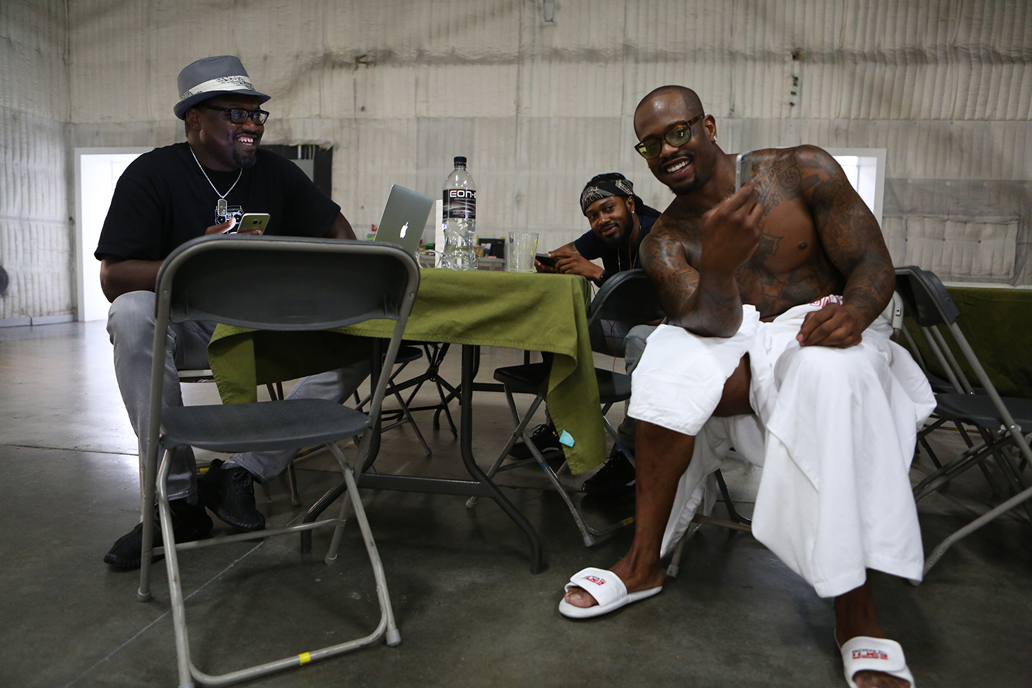  &nbsp;Miller hangs out with his agent, left, and his brother, center, during a short break. © Gail Fisher for ESPN    