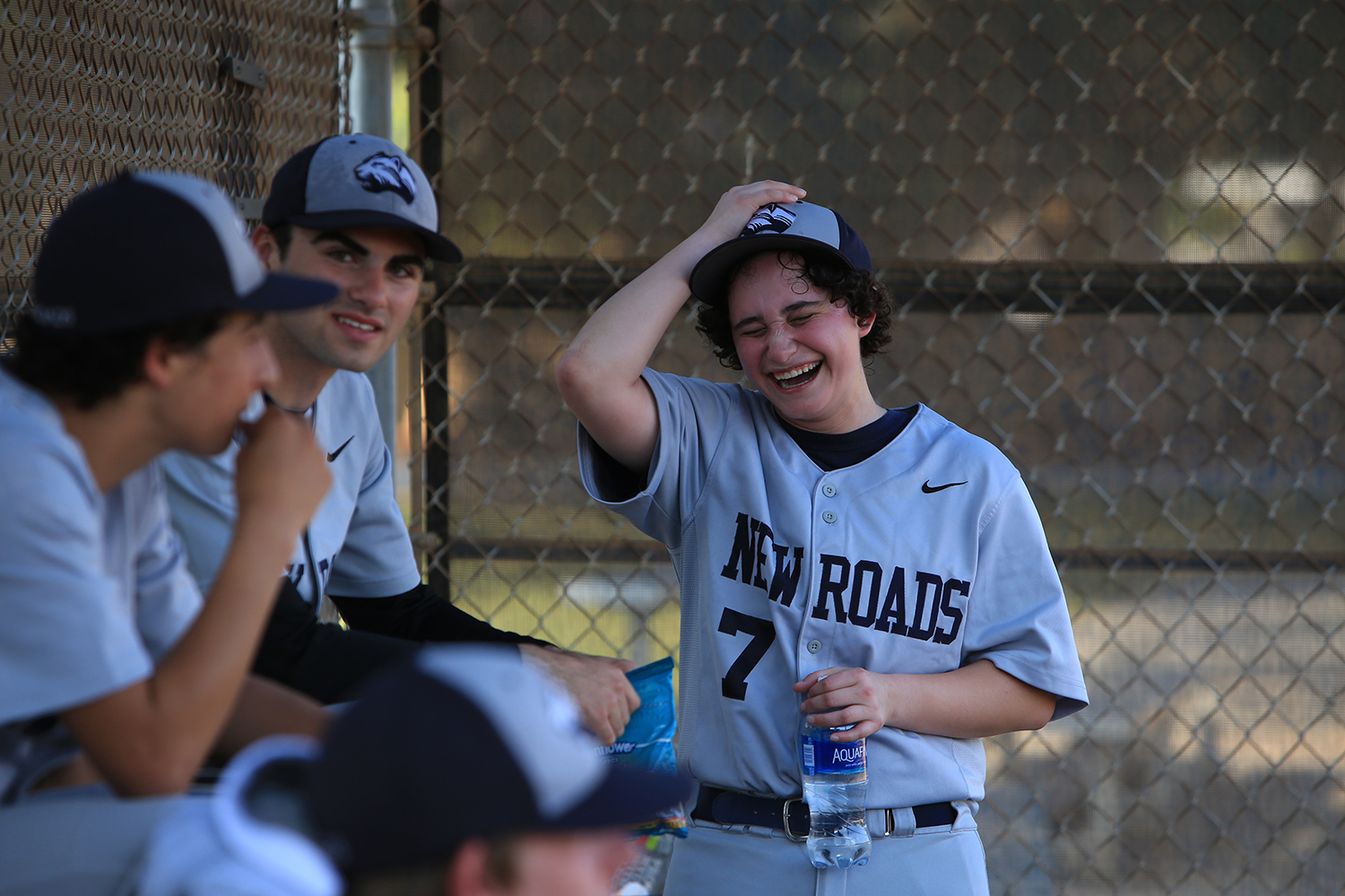 Jake Hofheimer, right, 17-year-old transgender male plays second baseman and outfielder on the New Roads Jaguars baseball team,&nbsp;jokes around with friend, Jake Boyle, center. © Gail Fisher for ESPN 