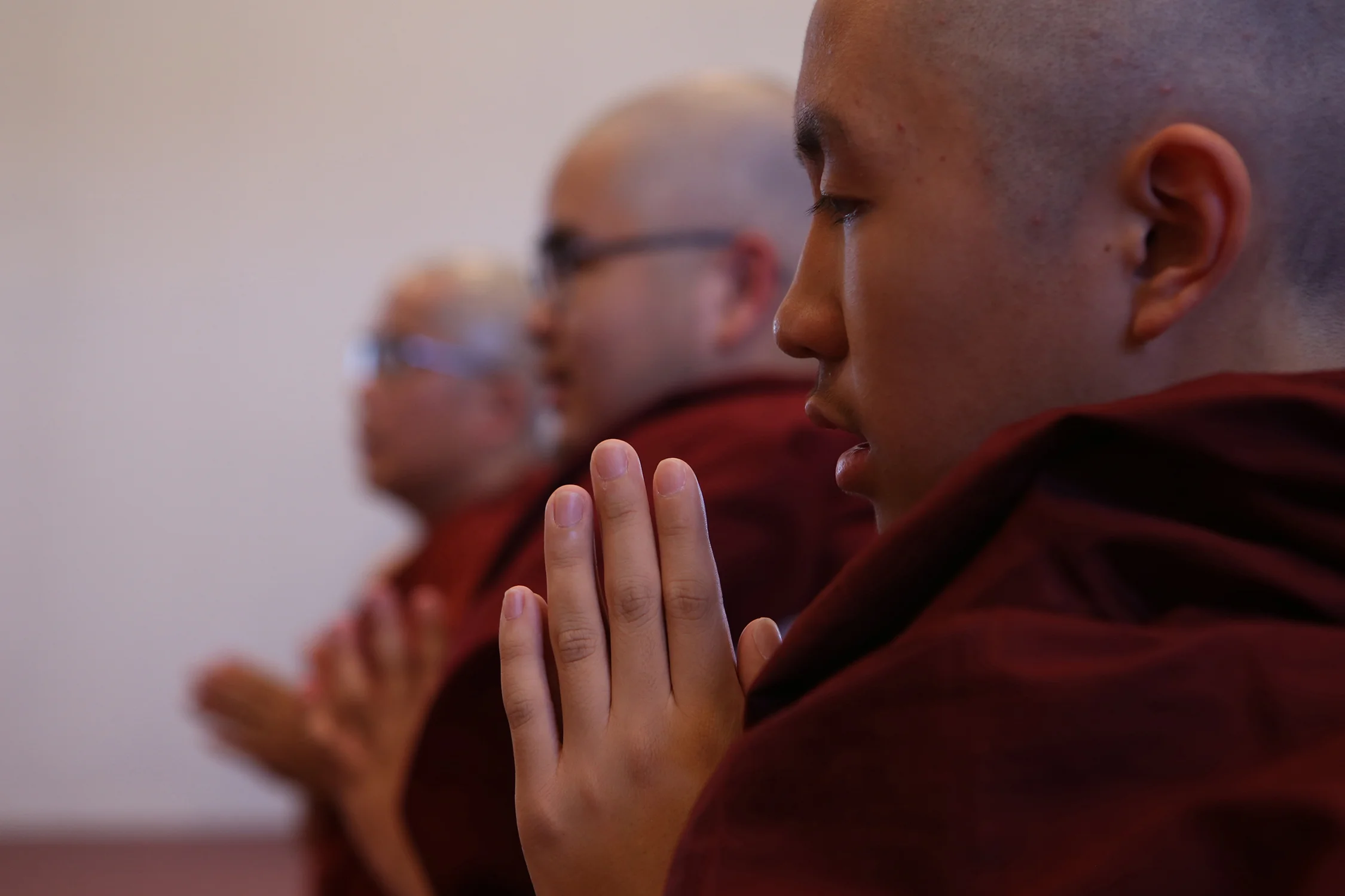 “Shaving my head gives up vanity and becoming a monk shows respect to my parents and giving thanks for bringing me on this earth.” said Filbert Win Min Aung, in foreground, a freshman at Arcadia High School. © Gail Fisher for Los Angeles Times