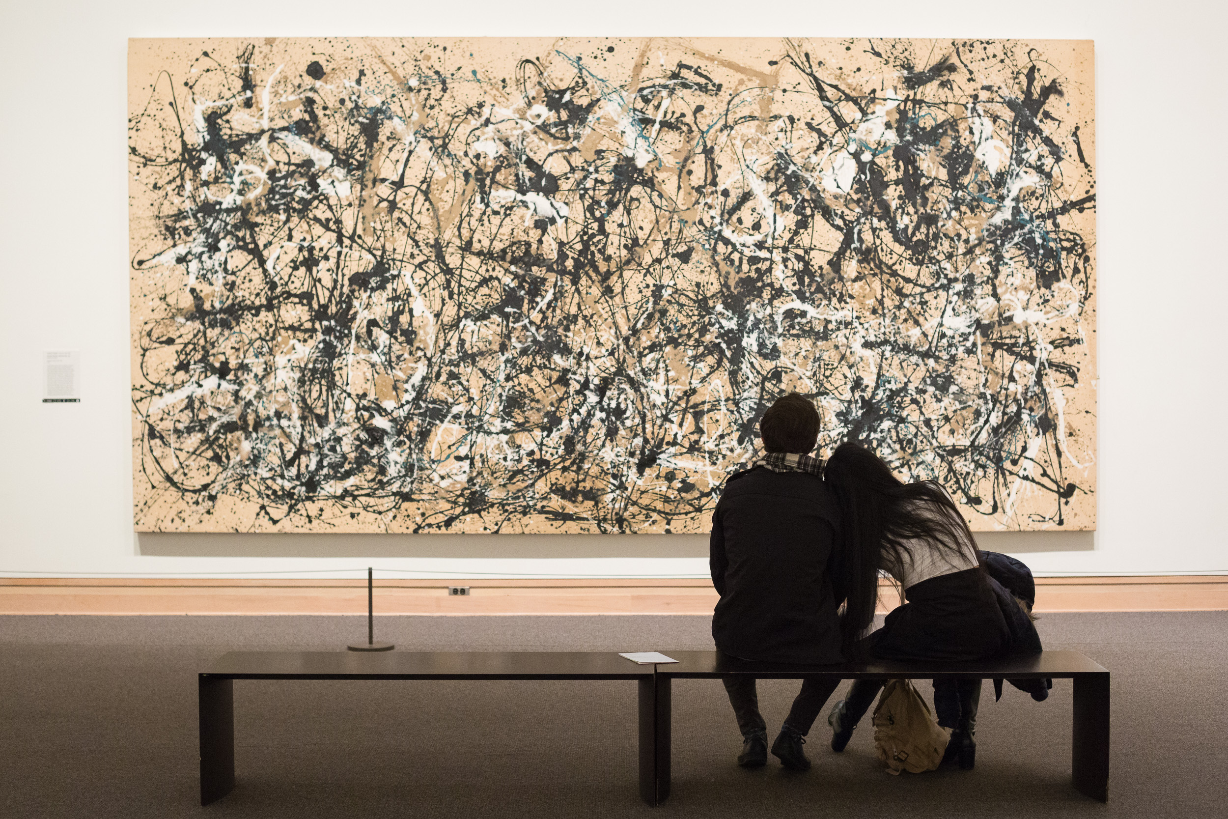  A couple views Jackson Pollock’s  Autumn Rhythm (Number 30)  at the Metropolitan Museum of Art, New York Dec. 22, 2017. 