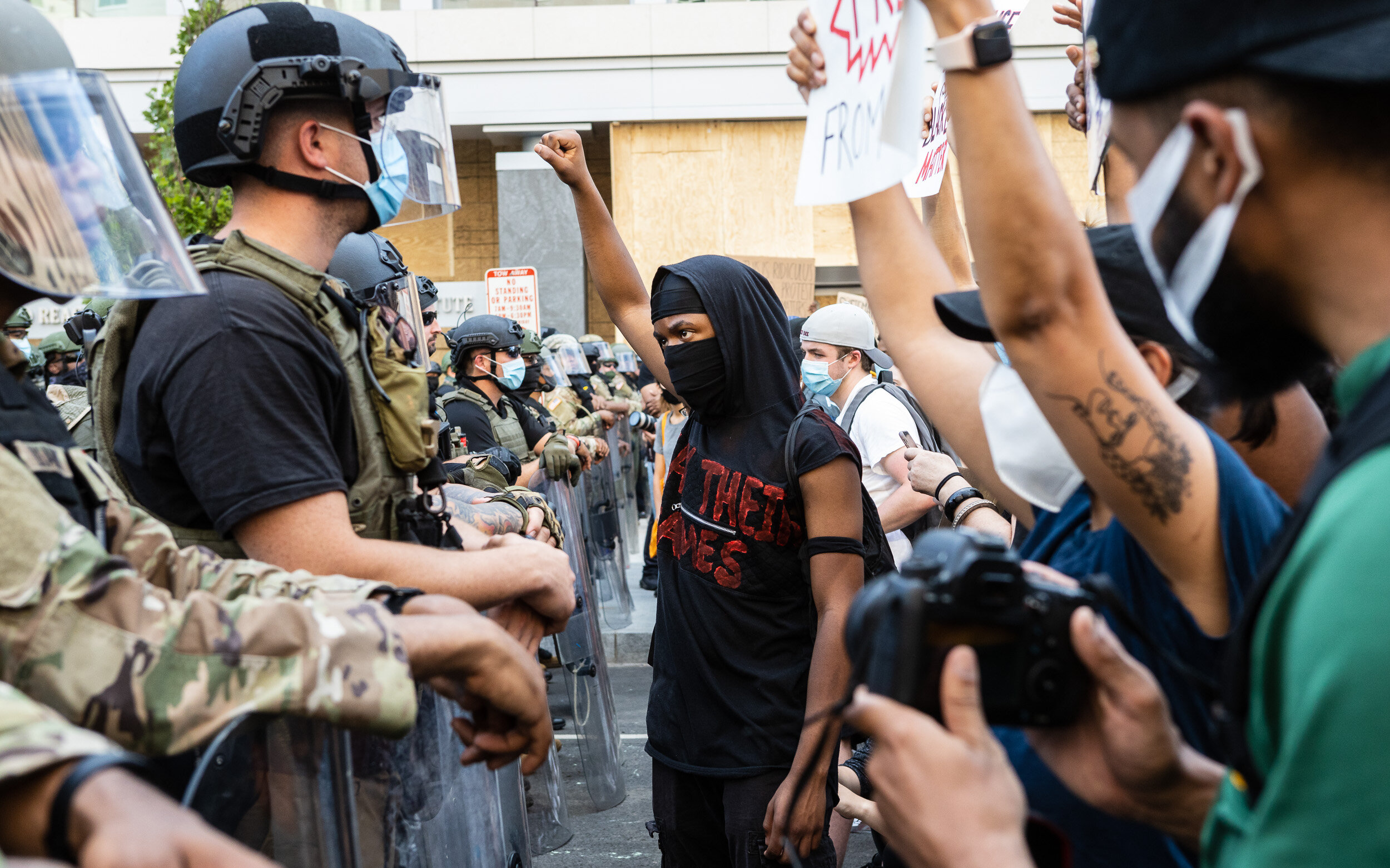  A protester confronts a line of National Guard officers near the White House during a demonstration in reaction to the death of George Floyd June 3, 2020. 