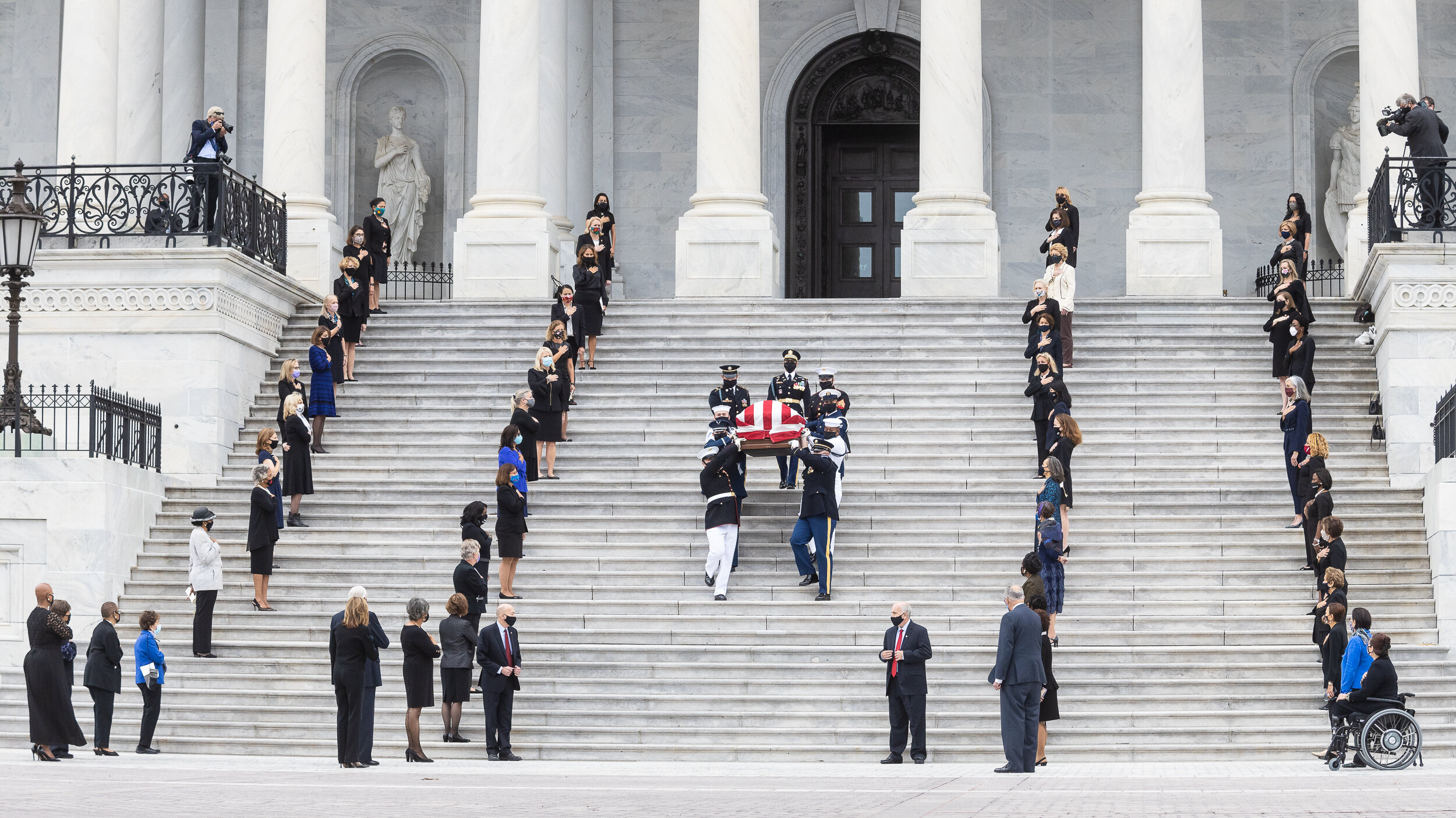  The casket of late Supreme Court Justice Ruth Bader Ginsburg is carried out of the U.S. Capitol as women lawmakers line the steps in tribute Sept. 15, 2020. Ginsburg was the first woman to lie in state in the Capitol. 