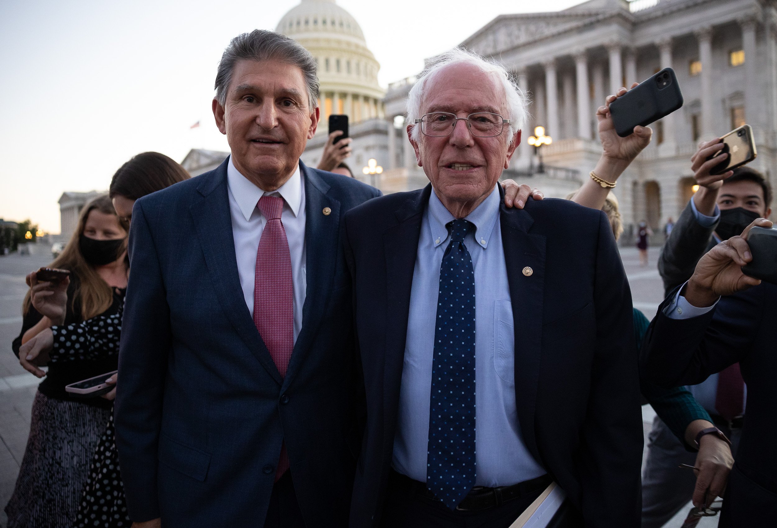  Sens. Joe Manchin (D-W.Va.) and Bernie Sanders (I-Vt.) on Capitol Hill during negotiations on the Build Back Better Act Oct. 18, 2021. 