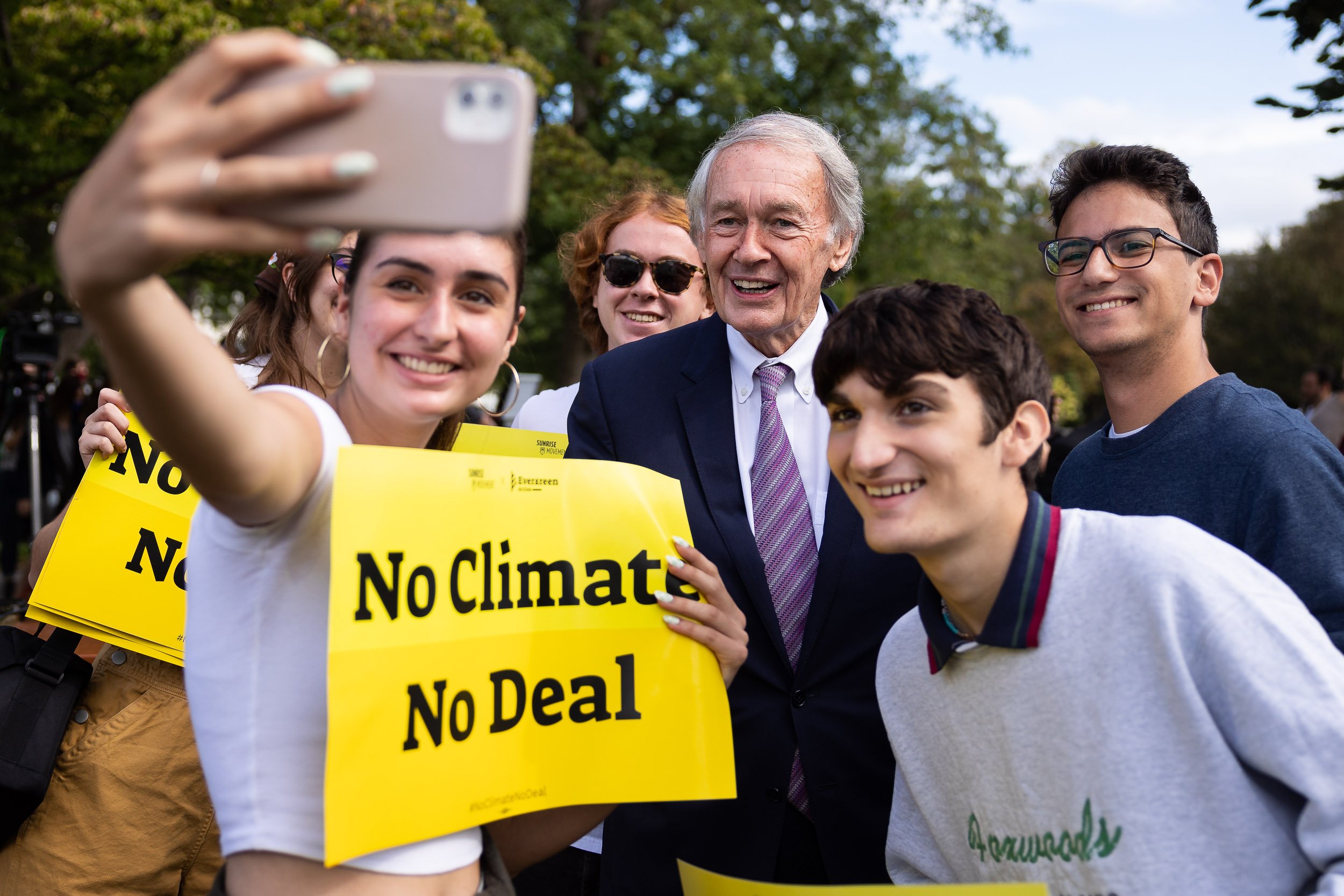  Sen. Ed Markey (D-Mass.) takes a selfie with climate activists after a press conference on Capitol Hill Oct. 7, 2021. 