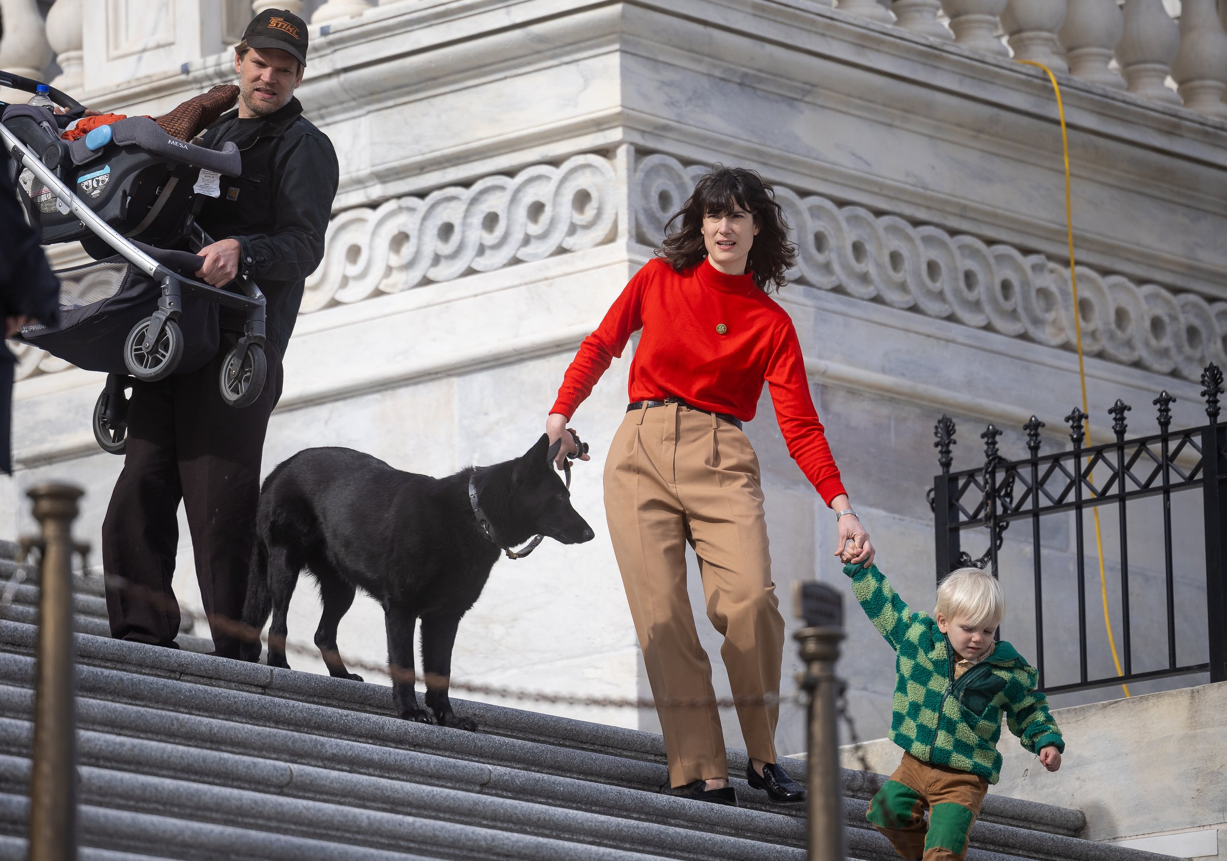  Rep. Marie Gluesenkamp Perez (D-Wash.) corrals her dog, Uma Furman, and her son, Ciro, while her husband, Dean Gluesenkamp, carries a stroller, outside the U.S. Capitol Nov. 15, 2023. 
