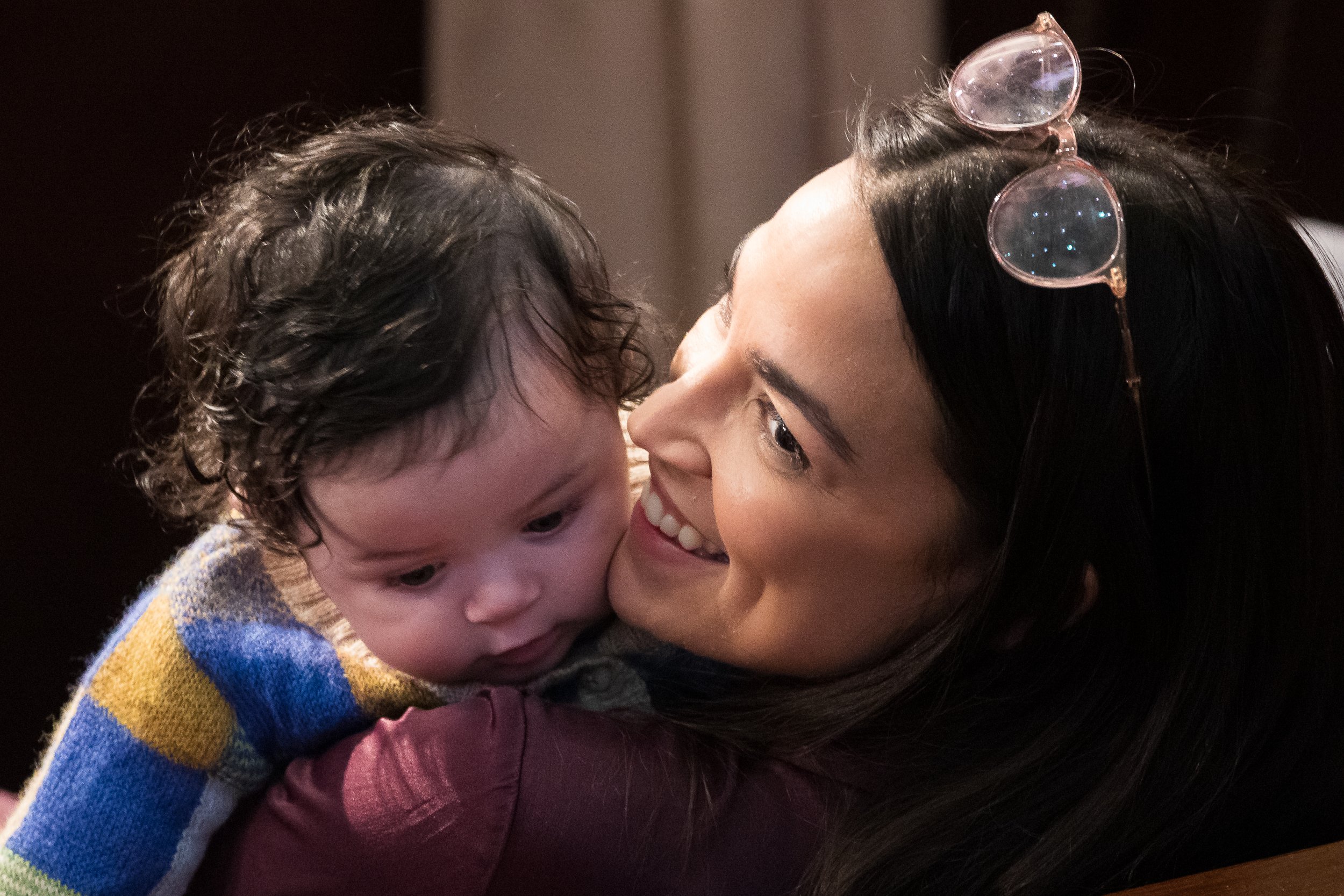  Rep. Alexandria Ocasio-Cortez (D-N.Y.) holds California Democratic Rep. Jimmy Gomez's son, Hodge, on the House floor during a House speakership election vote at the U.S. Capitol Jan. 5, 2023. 