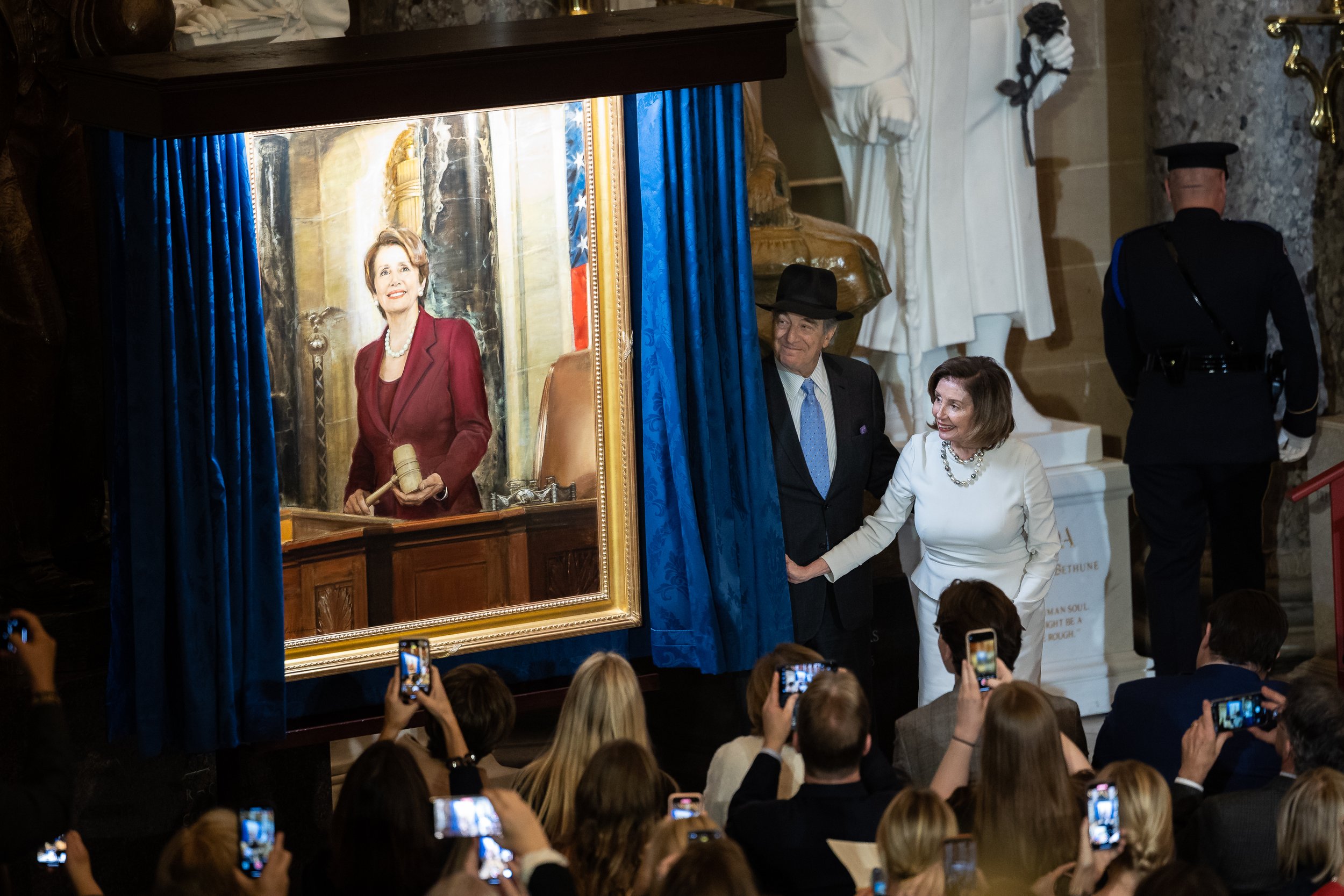  House Speaker Nancy Pelosi (D-Calif.) and her husband, Paul Pelosi, unveil her official portrait in Statuary Hall at the U.S. Capitol Dec. 14, 2022. 