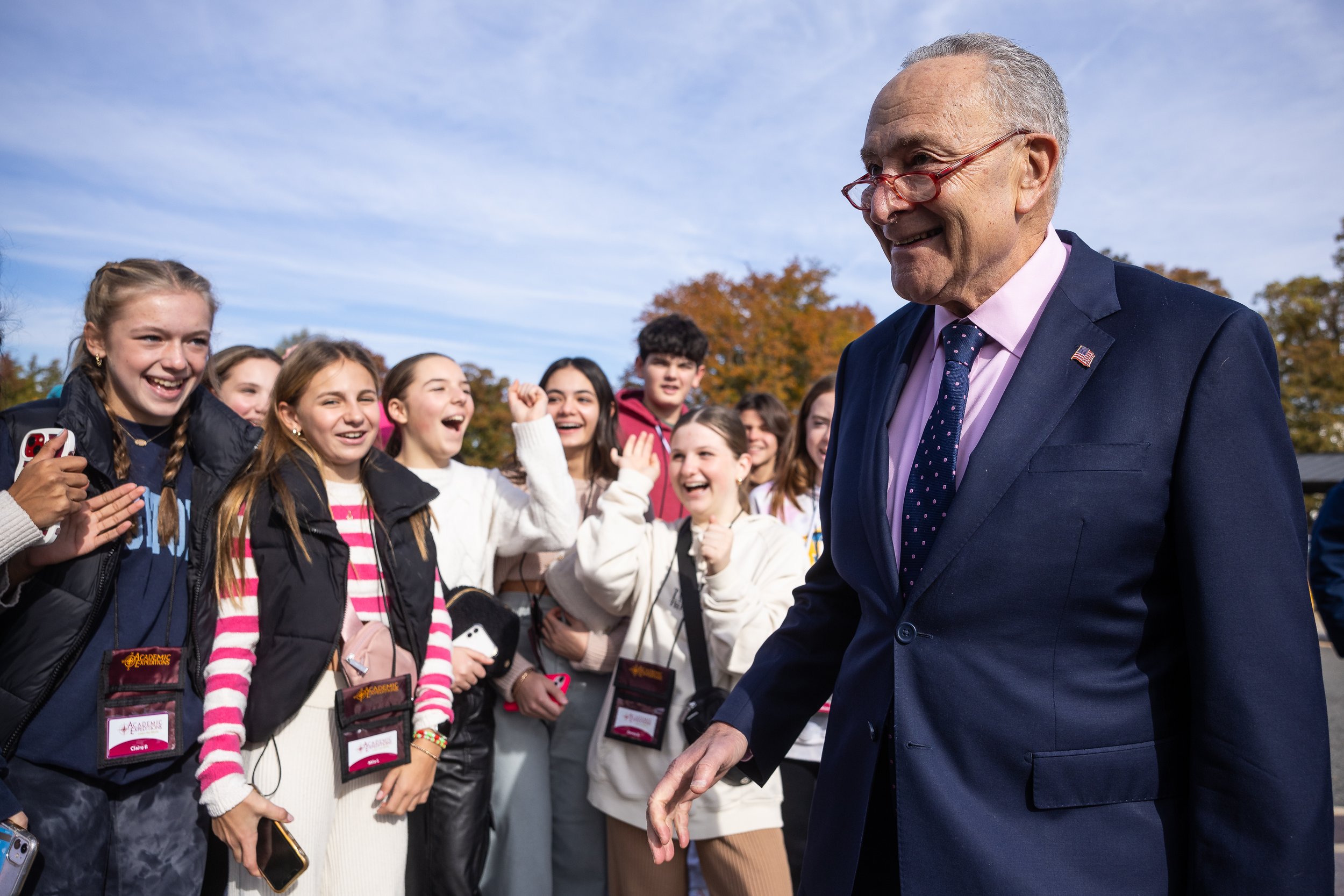  Senate Majority Leader Chuck Schumer (D-N.Y.) stops to greet a group of visiting students as he departs a press conference outside the U.S. Capitol Nov. 15, 2023.  