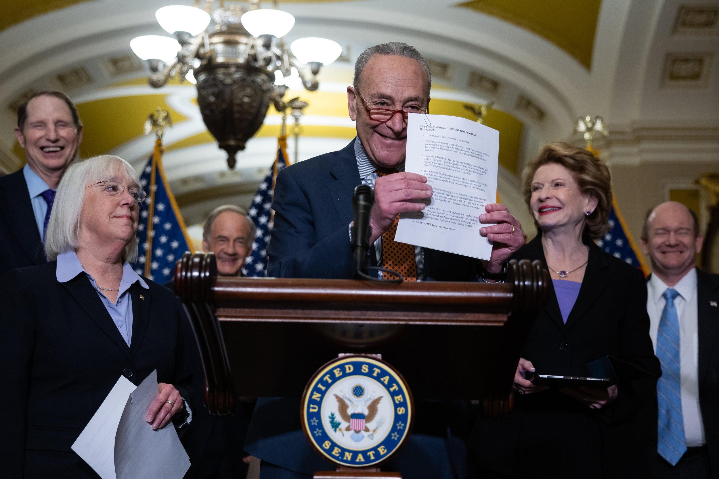  Senate Majority Leader Chuck Schumer (D-N.Y.) jokingly invites journalists to photograph his notes while other Senate Democrats react during a press conference at the U.S. Capitol May 3, 2023. This was an allusion to the photograph I took of his not