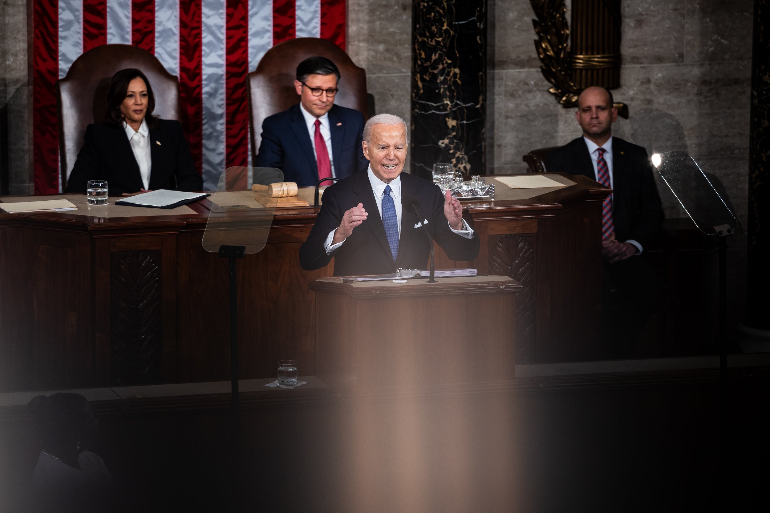  President Joe Biden delivers his State of the Union address as Vice President Kamala Harris and House Speaker Mike Johnson (R-La.) look on in the House chamber at the U.S. Capitol March 7, 2024. (Francis Chung/POLITICO) 