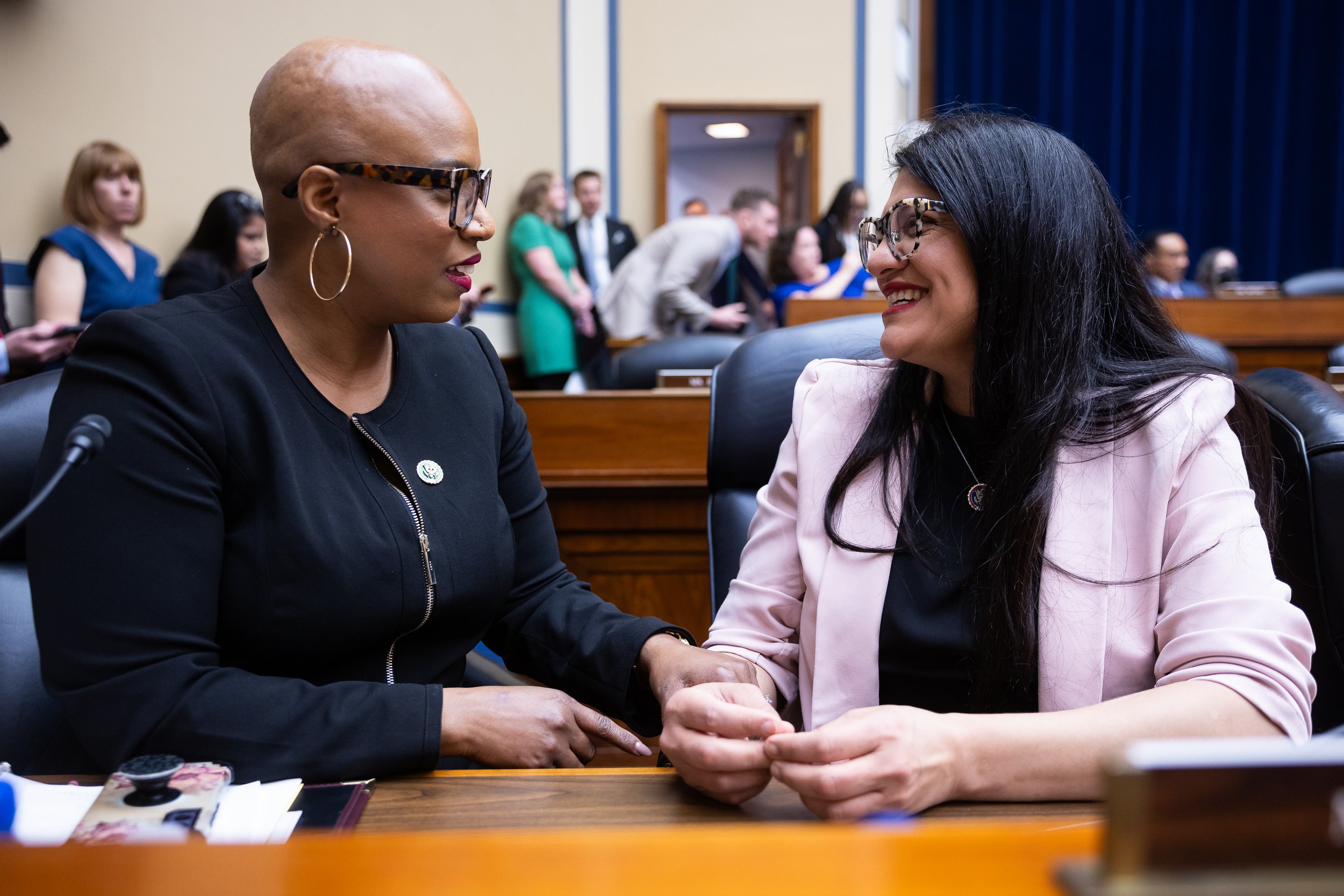  Reps. Ayanna Pressley (D-Mass.) and Rashida Tlaib (D-Mich.) confer during a House Oversight and Accountability Committee hearing on Capitol Hill March 20, 2024. 