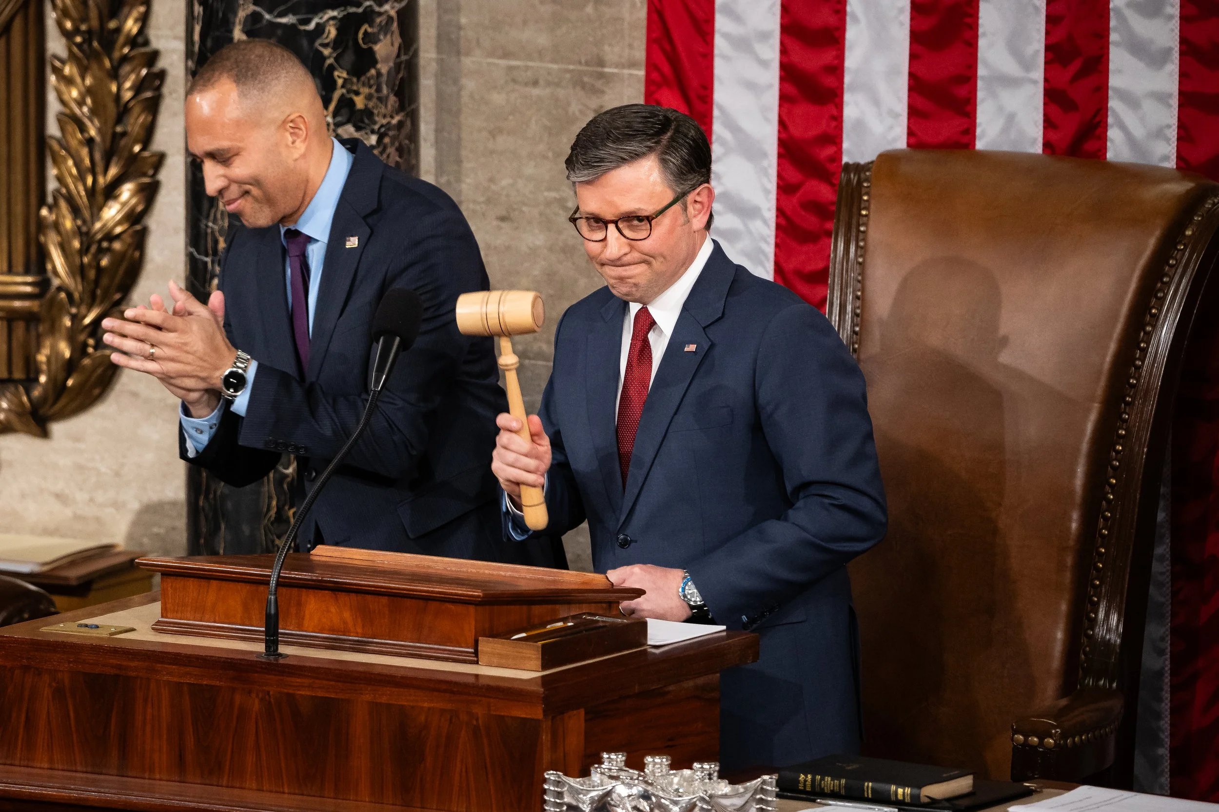  House Speaker Mike Johnson (R-La.) reacts after receiving the House Speaker's gavel from House Minority Leader Hakeem Jeffries (D-N.Y.) in the House chamber at the U.S. Capitol Jan. 3, 2025.  