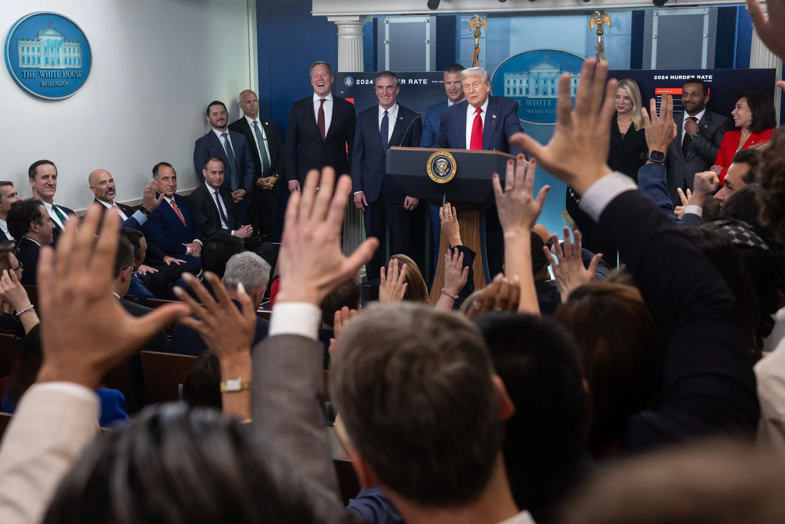  President Donald Trump, flanked by members of his administration, holds a press briefing in the James S. Brady Press Briefing Room at the White House Aug. 11, 2025.  