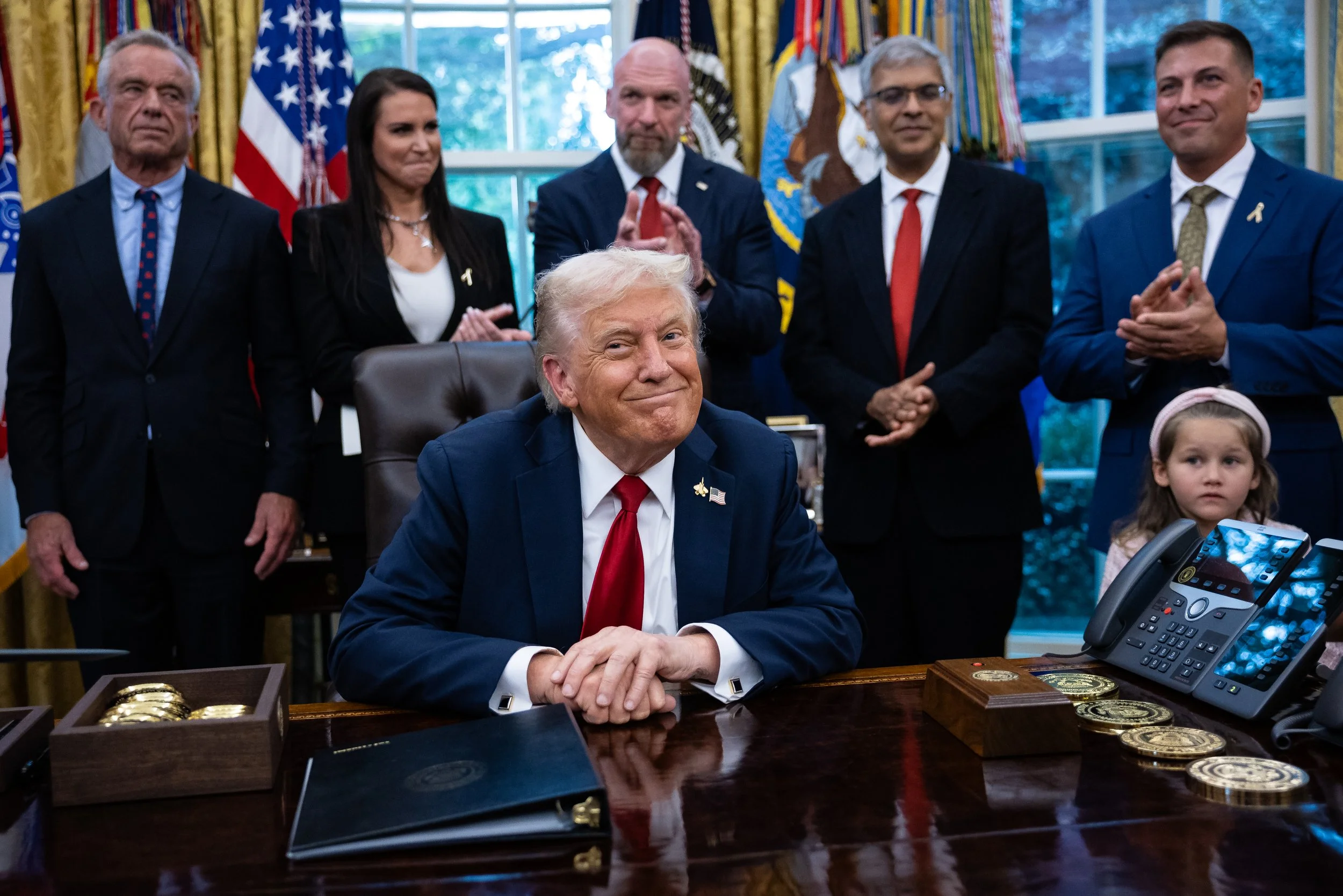  President Donald Trump is seen with guests during an announcement on using artificial intelligence to treat childhood cancer in the Oval Office at the White House Sept. 30, 2025.  
