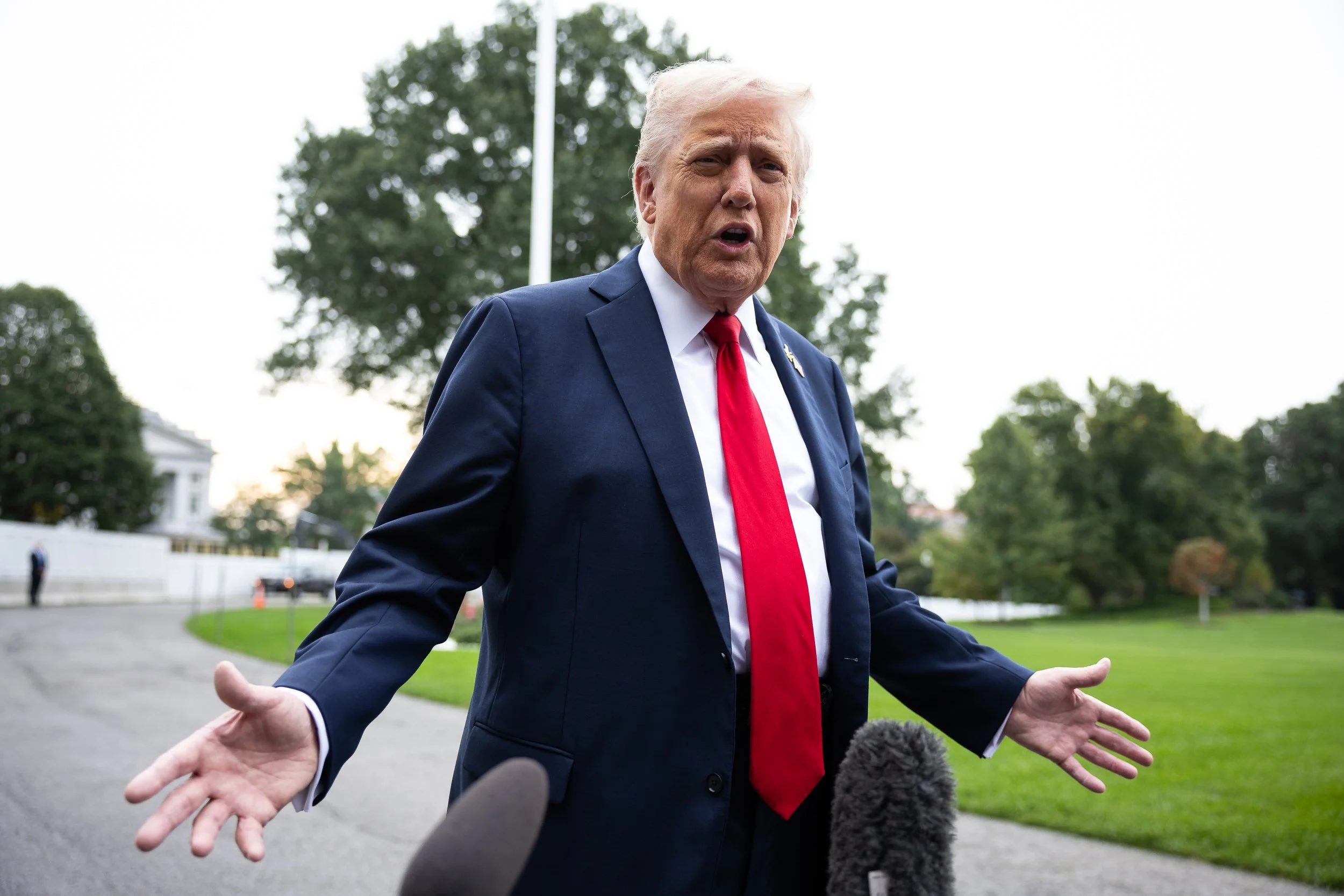  President Donald Trump speaks with reporters on the South Lawn of the White House on his way to board Marine One Sept. 30, 2025. 