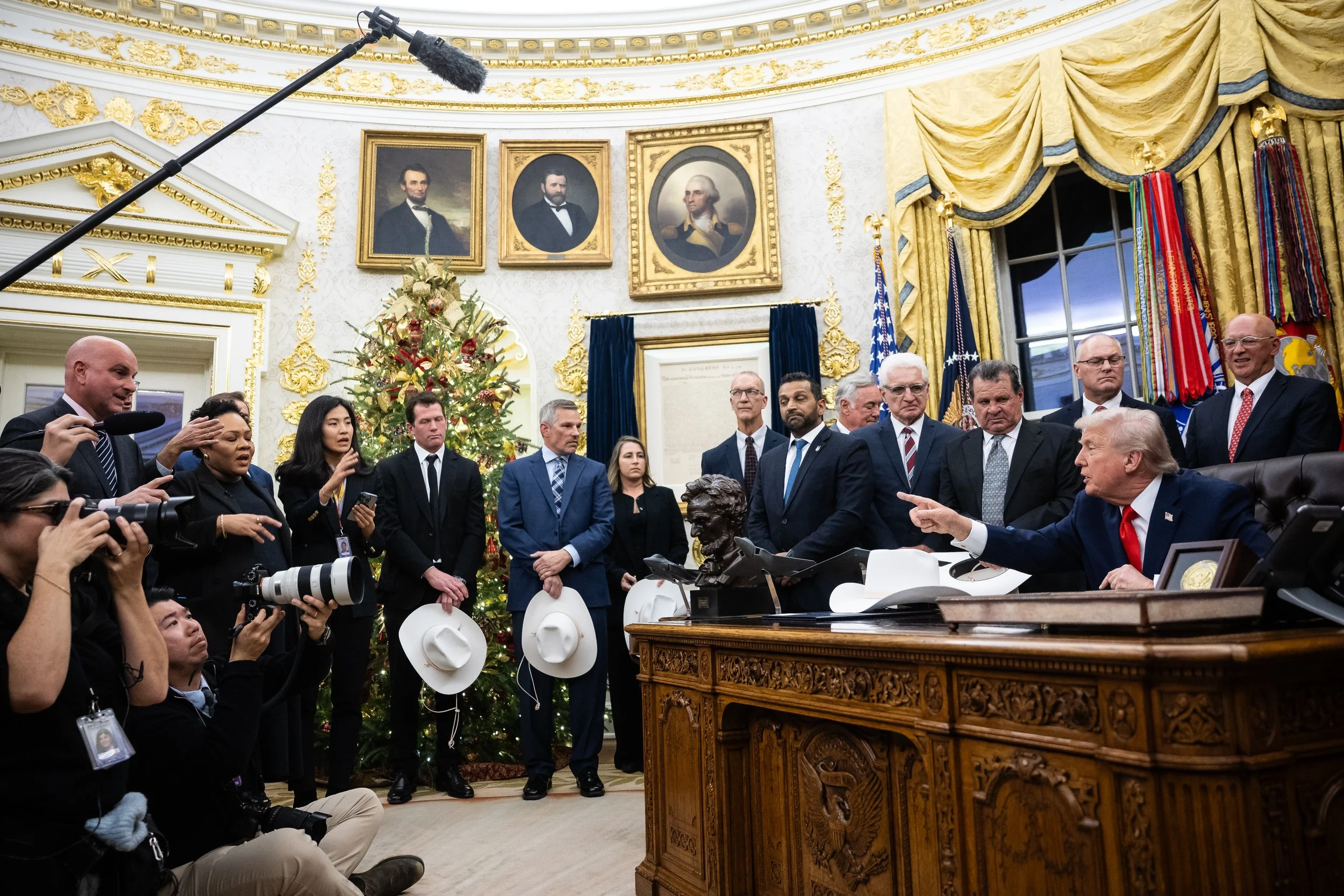  President Donald Trump takes part in a bill signing to award Congressional Gold Medals to the 1980 U.S. Olympic ice hockey team in the Oval Office at the White House Dec. 12, 2025.  