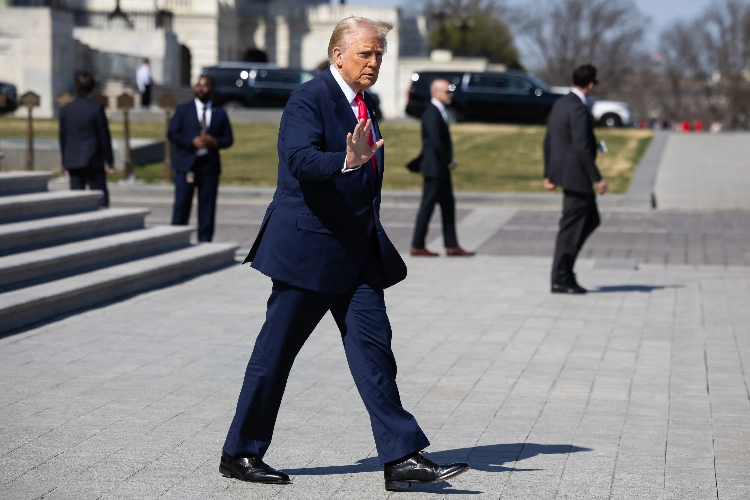  President Donald Trump waves outside the U.S. Capitol as he departs the Friends of Ireland Luncheon March 12, 2025.  