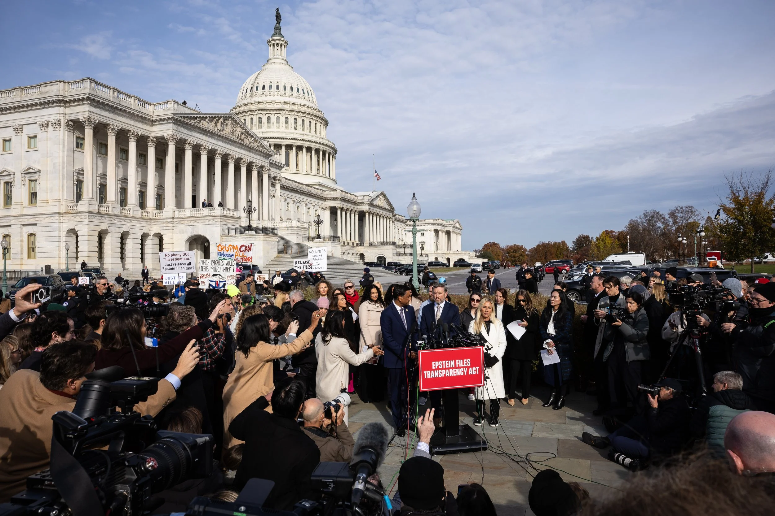  Reps. Ro Khanna (D-Calif.), Thomas Massie (R-Ky.), and Marjorie Taylor Greene (R-Ga.) take questions while standing with victims of convicted sex offender Jeffrey Epstein during a press conference on the Epstein Files Transparency Act outside the U.