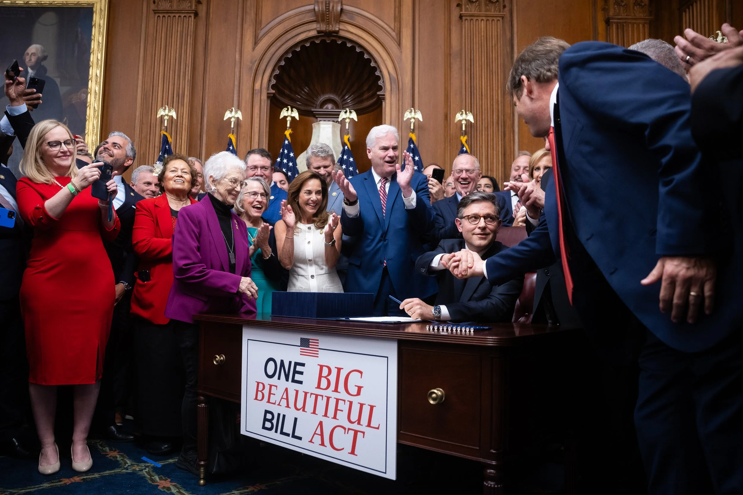  House Speaker Mike Johnson (R-La.) signs a budget reconciliation bill for President Trump's legislative agenda after House passage at the U.S. Capitol July 3, 2025. 
