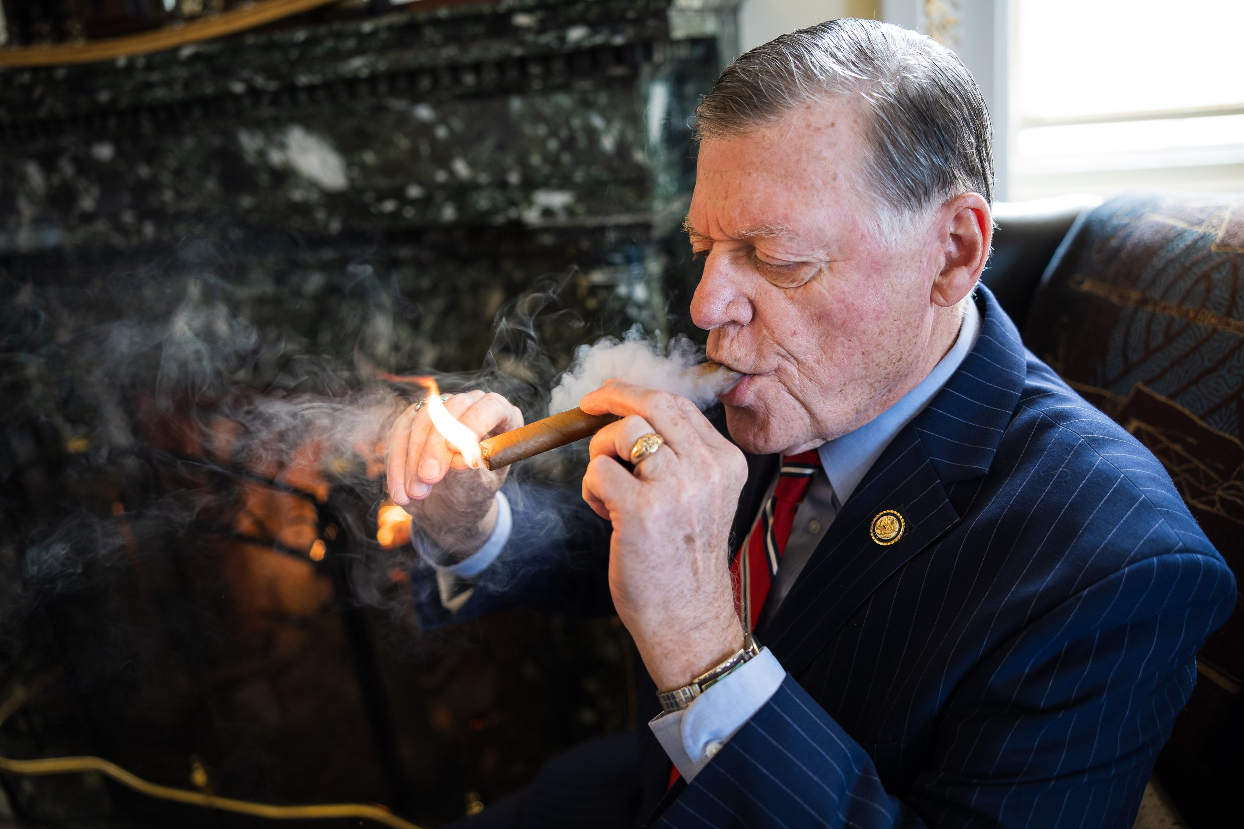  House Appropriations Committee Chair Tom Cole (R-Okla.) lights a cigar in his office at the U.S. Capitol Feb. 5, 2026.  