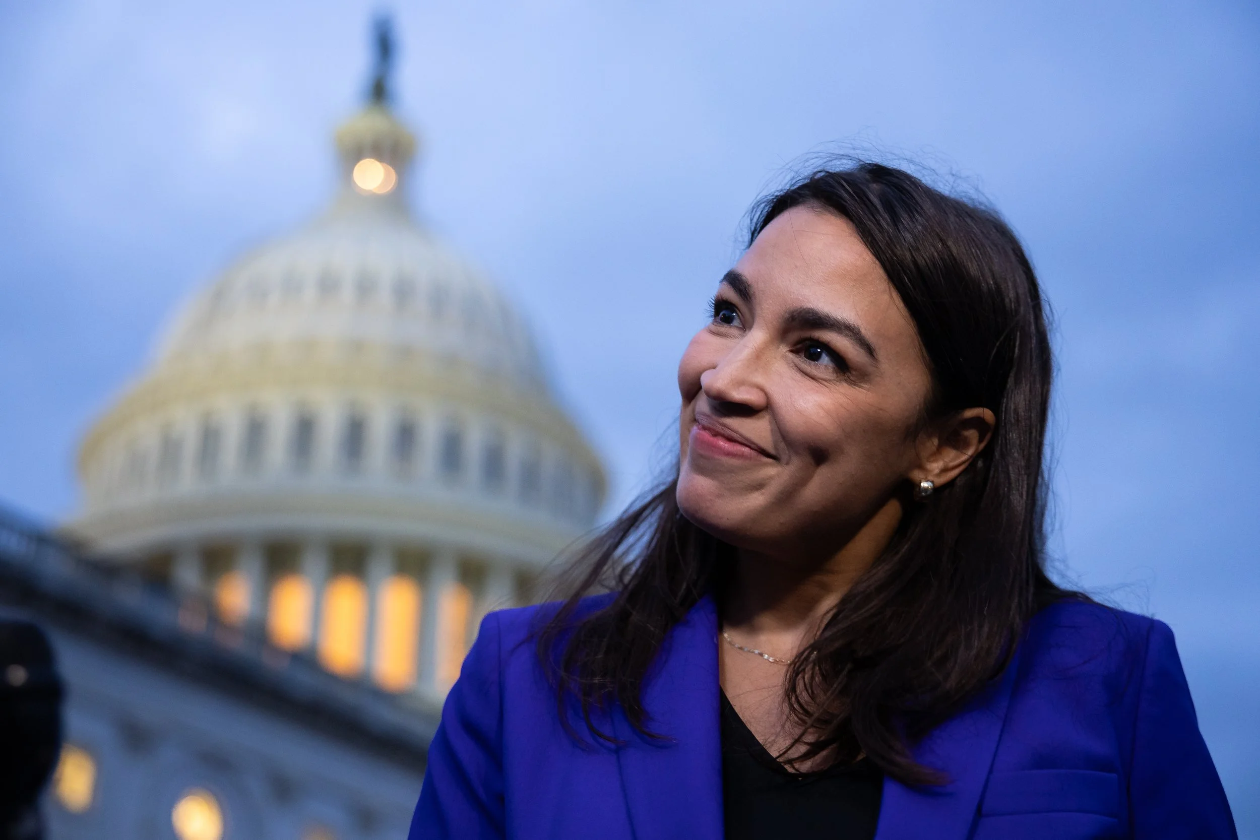  Rep. Alexandria Ocasio-Cortez (D-N.Y.) speaks with reporters outside the U.S. Capitol Sept. 17, 2024.  
