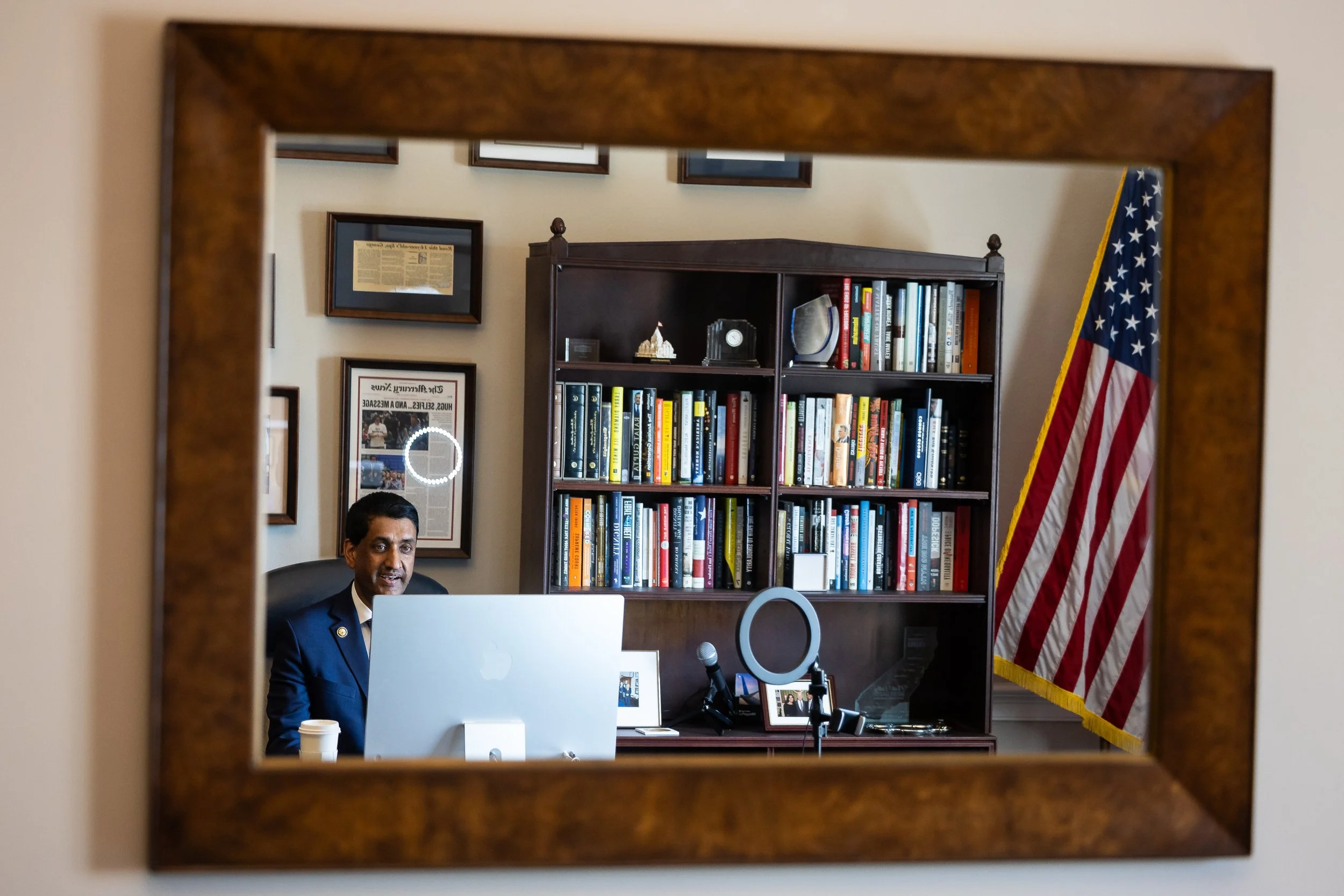  Rep. Ro Khanna (D-Calif.) is seen reflected in a mirror in his office on Capitol Hill as he takes part in a podcast interview with political commentator Glenn Beck May 20, 2025.  