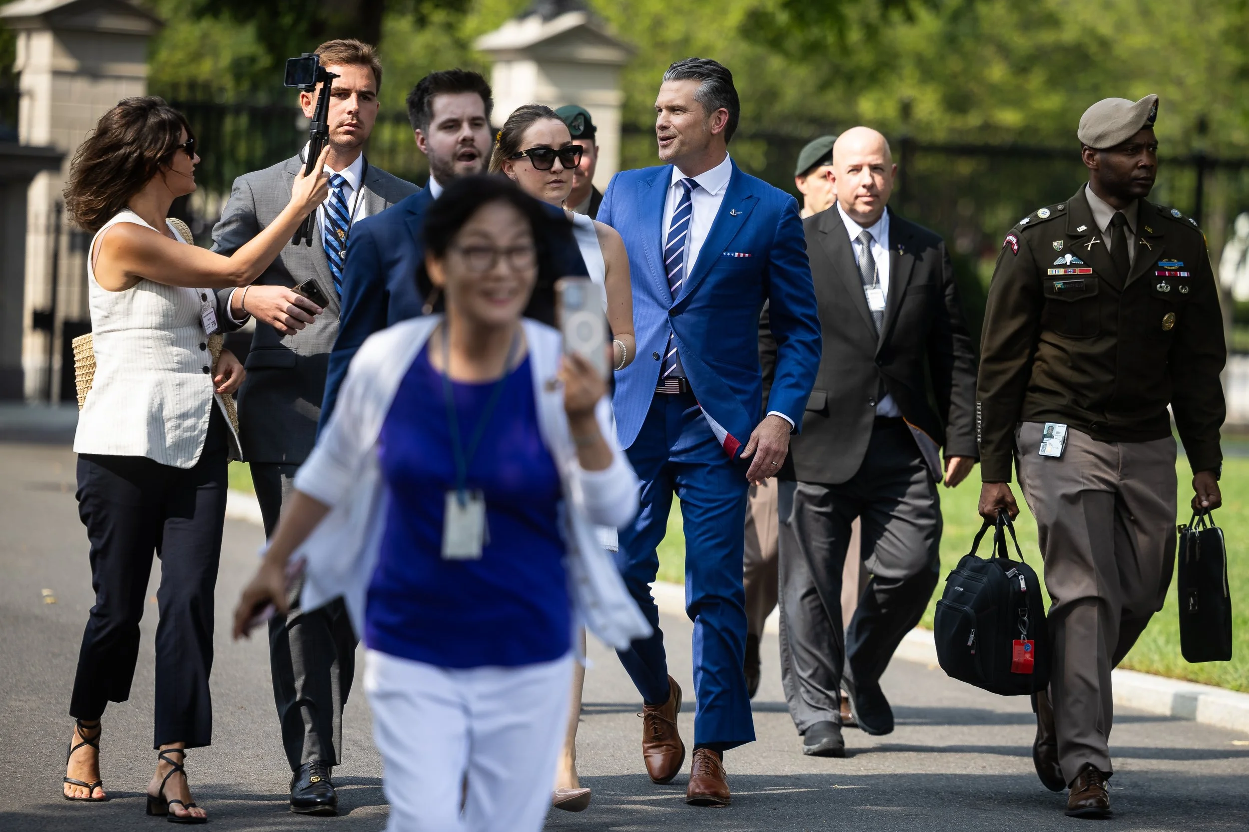  Defense Secretary Pete Hegseth speaks with reporters as he walks into the White House Aug. 7, 2025.  