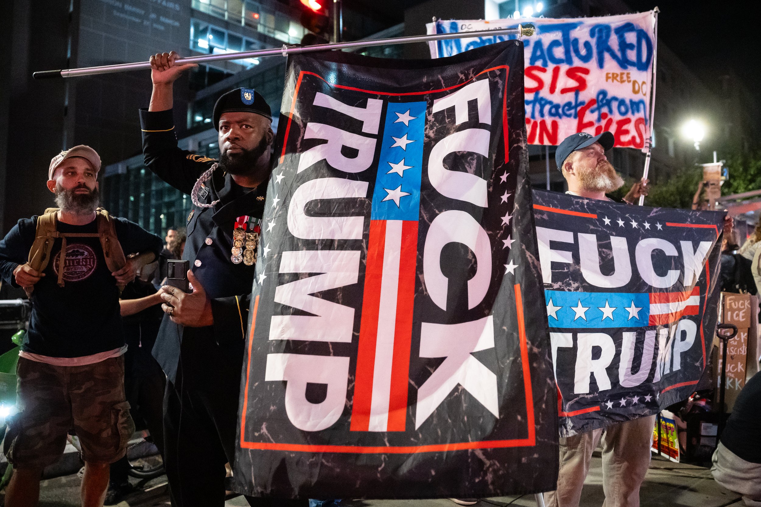  Protesters opposing the Trump administration's federalization of District of Columbia law enforcement and the deployment of the National Guard demonstrate at the intersection of 14th Street and U Street NW in Washington, D.C., Aug. 21, 2025.  