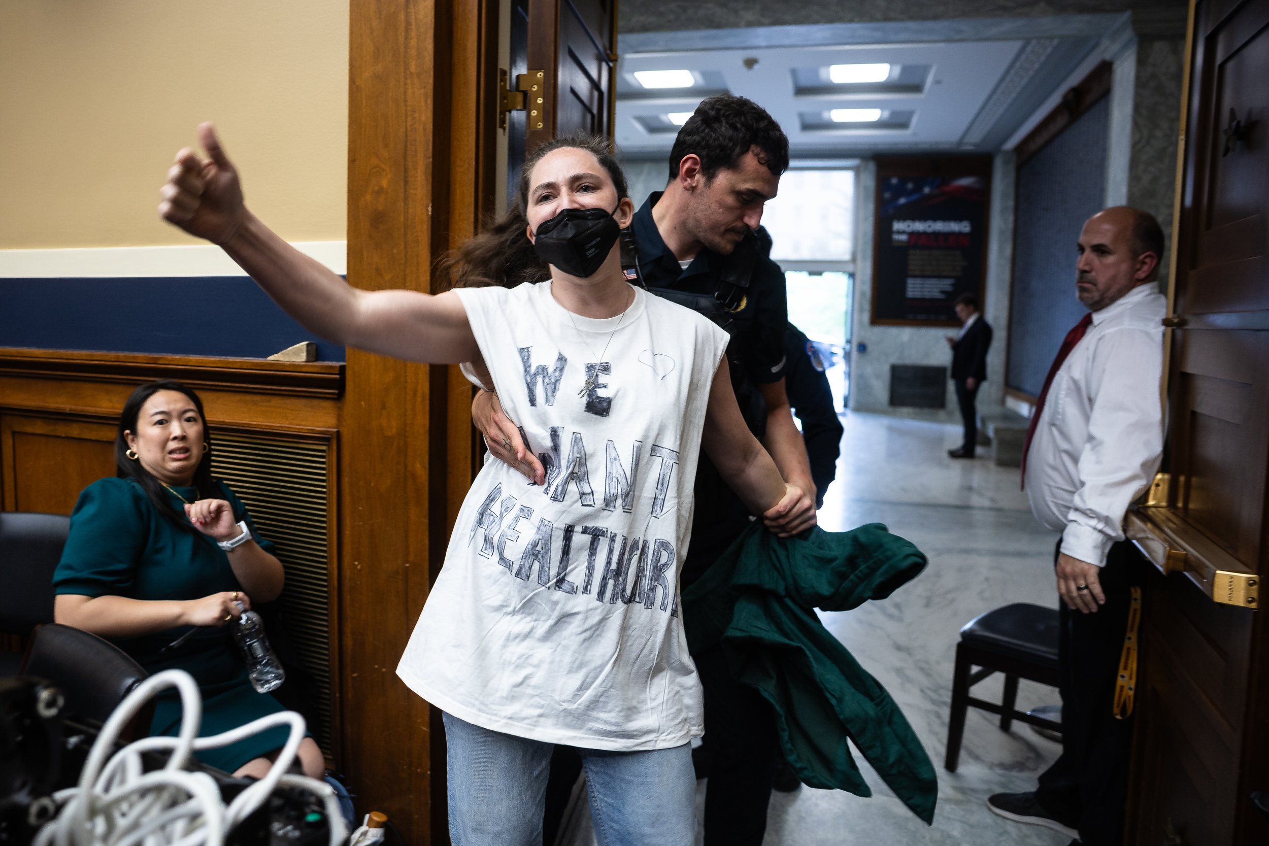  A protester is taken away by a U.S. Capitol Police officer after disrupting a House Energy and Commerce Committee markup on a budget reconciliation bill on Capitol Hill May 14, 2025.  