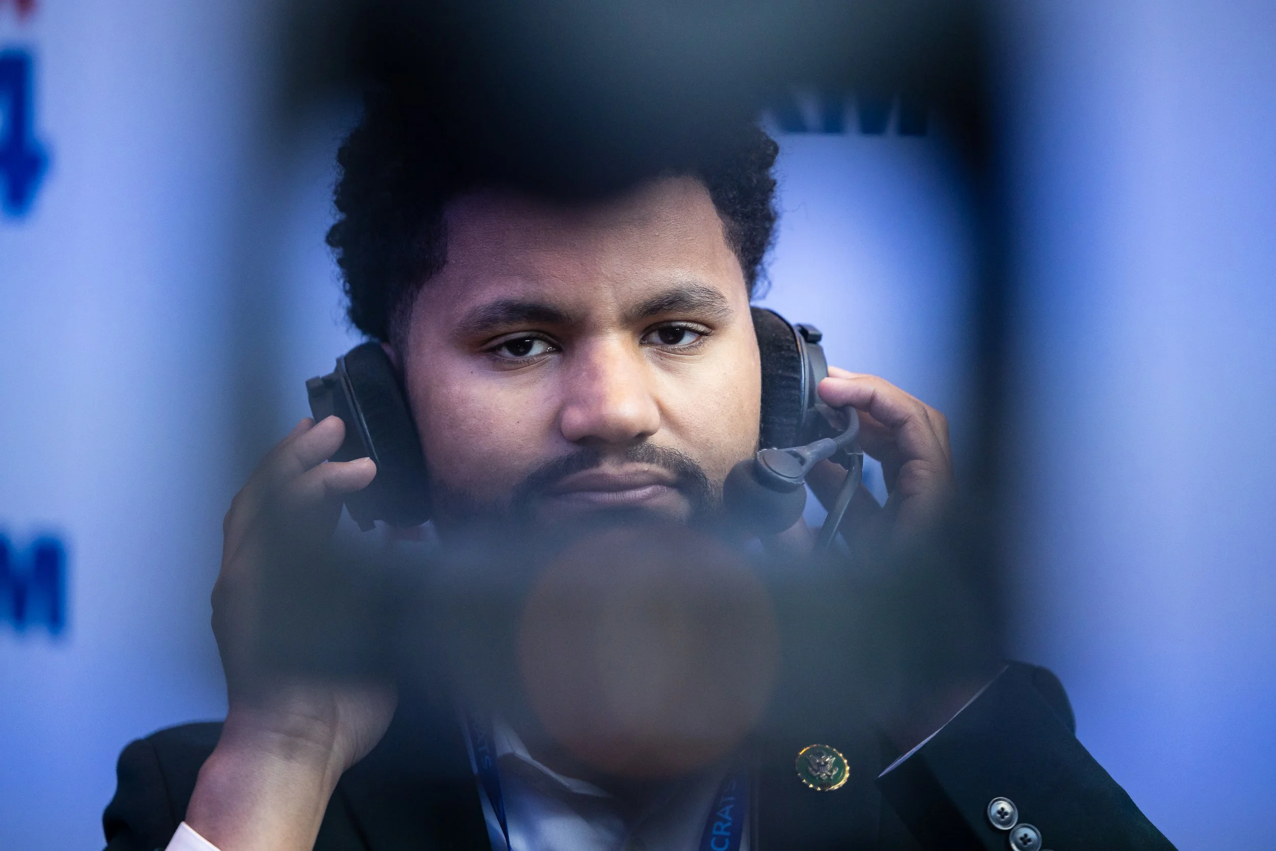  Rep. Maxwell Frost (D-Fla.) prepares for an interview before the start of the second day of the Democratic National Convention at the United Center in Chicago on Aug. 20, 2024.  