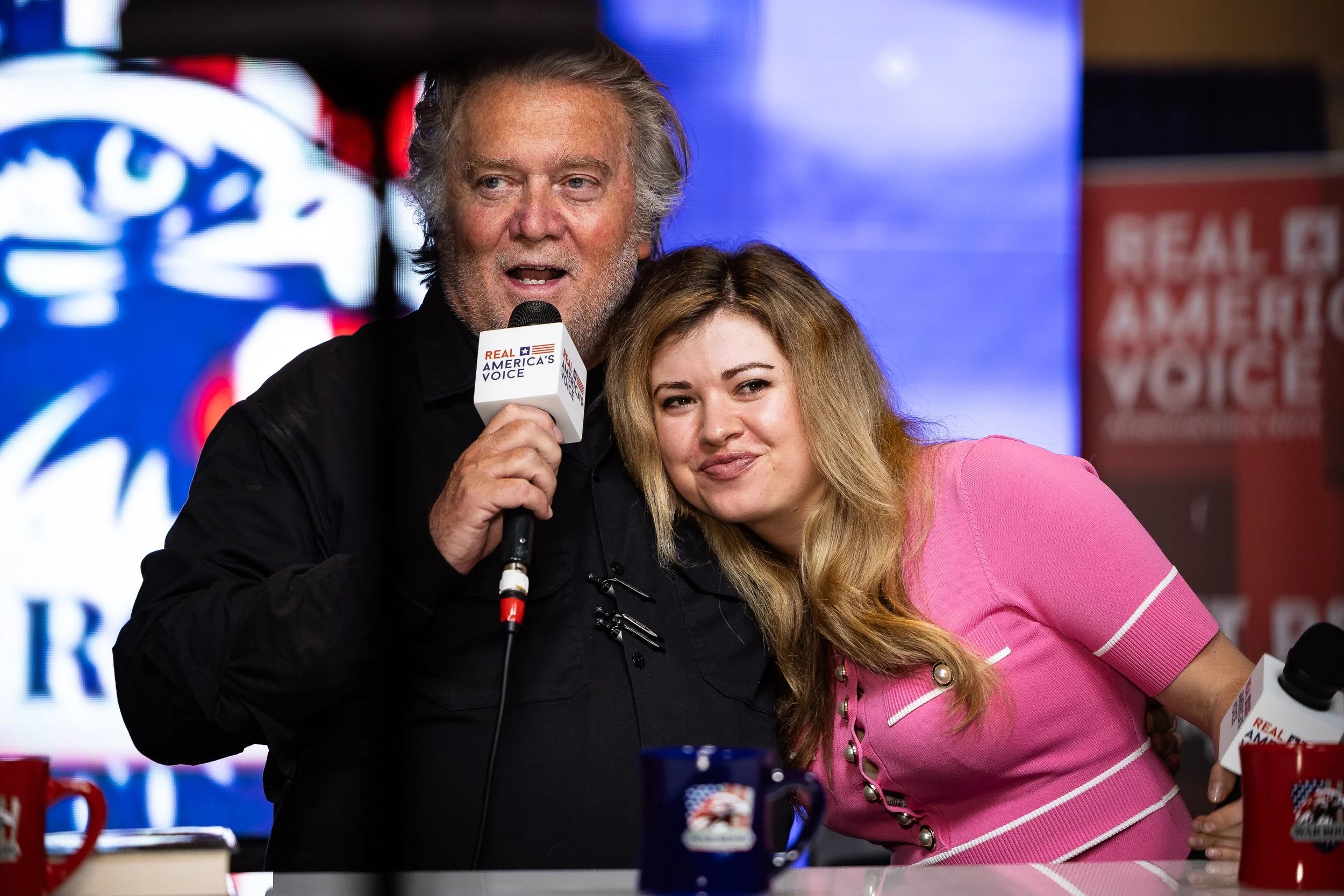  Steve Bannon, former advisor to former President Donald Trump, embraces his co-host, Natalie Winters, while wishing her a happy birthday as they record an episode of the War Room podcast during the Conservative Political Action Conference (CPAC) at 