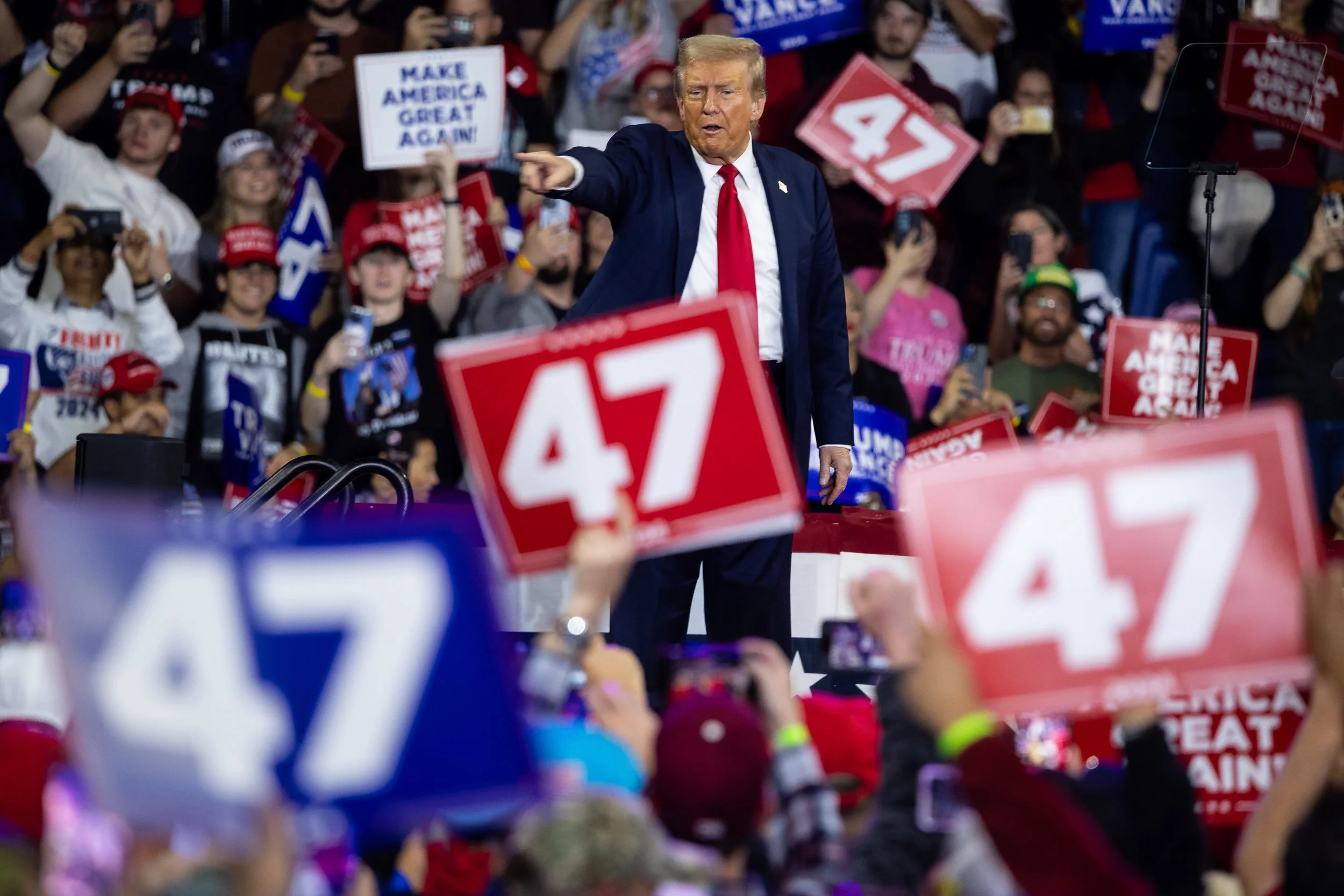  Former President Donald Trump gestures to supporters as he departs after delivering remarks during a rally at Santander Arena in Reading, Pa., Oct. 9, 2024.  