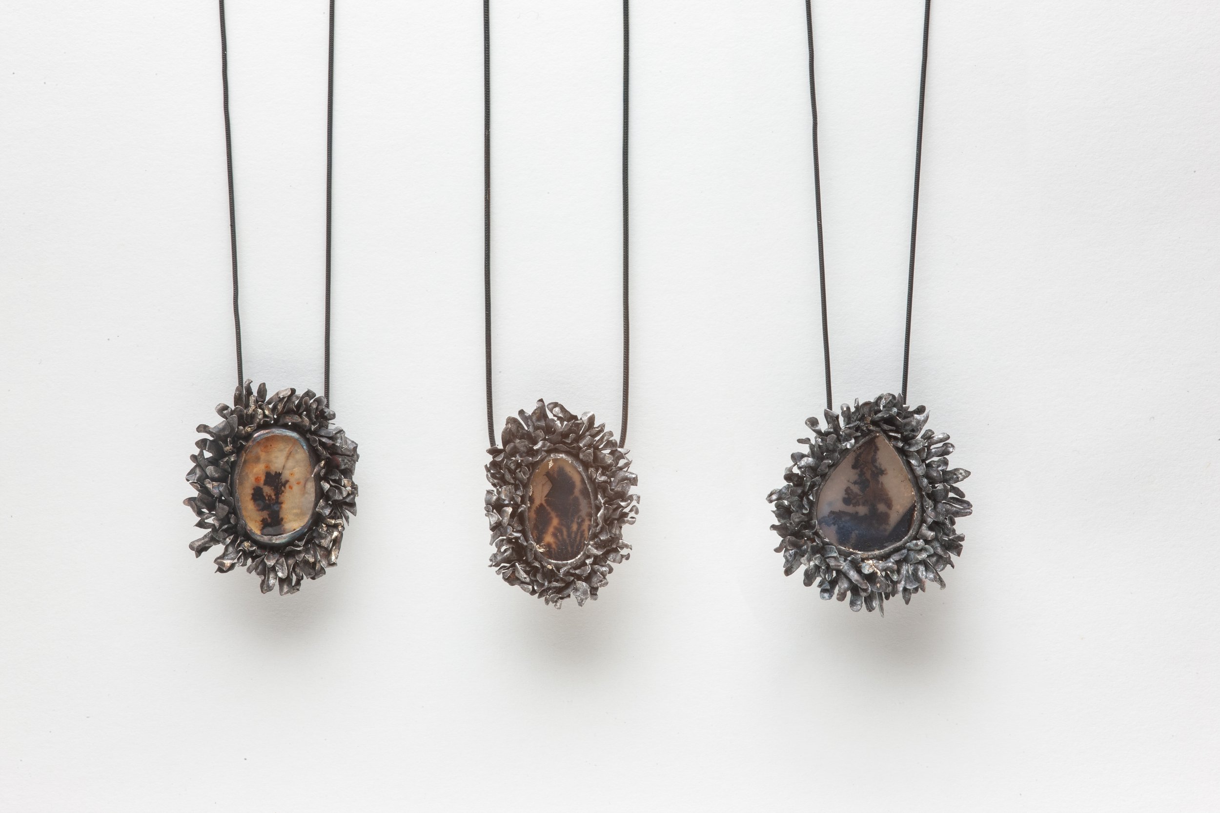 3 Feathered Pendants.jpg