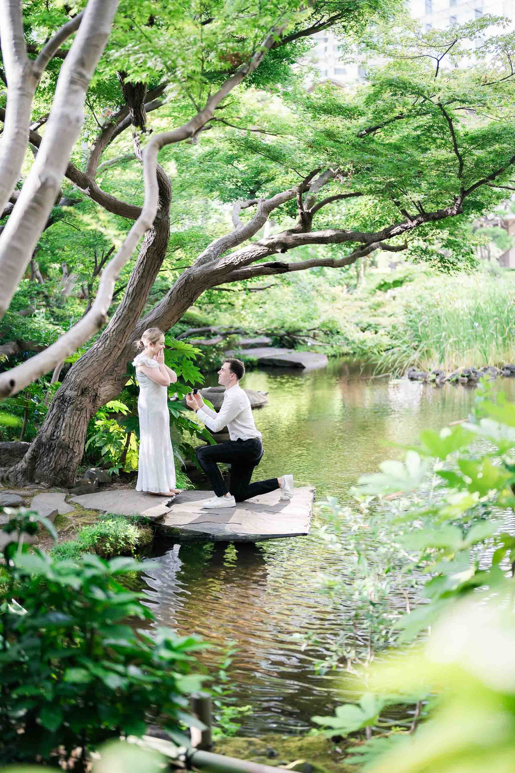 Tokyo stealthStealth surprise proposal moment in a quiet Japanese garden in Tokyo