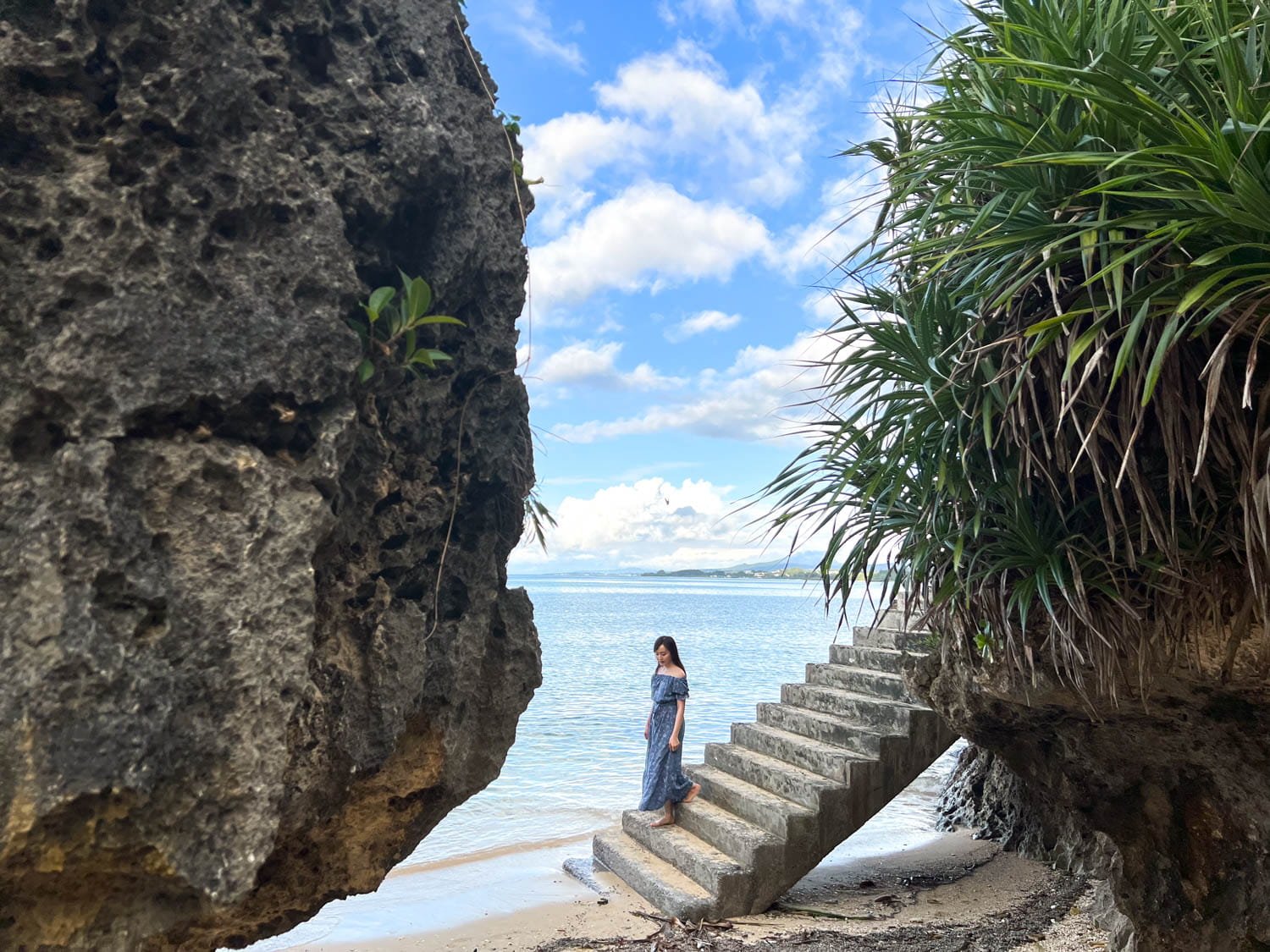 Instagram photoshoot a scenic staircase descending directly into the ocean, a popular photo spot on Senaha Beach in Okinawa
