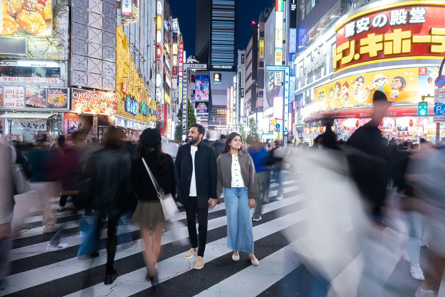 Classic time stop shot of a couple at Shinjuku Kabukicho crossing