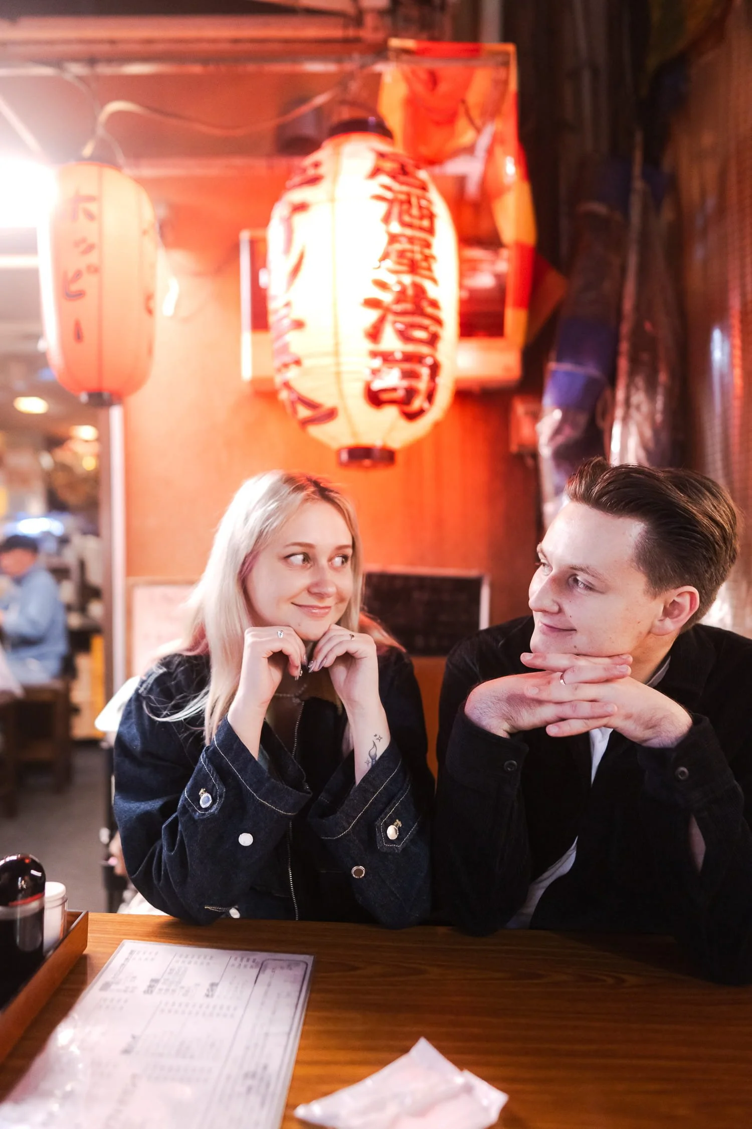 The couple chose to end the night a local izakaya where they sat under a red lantern in Hoppy Street